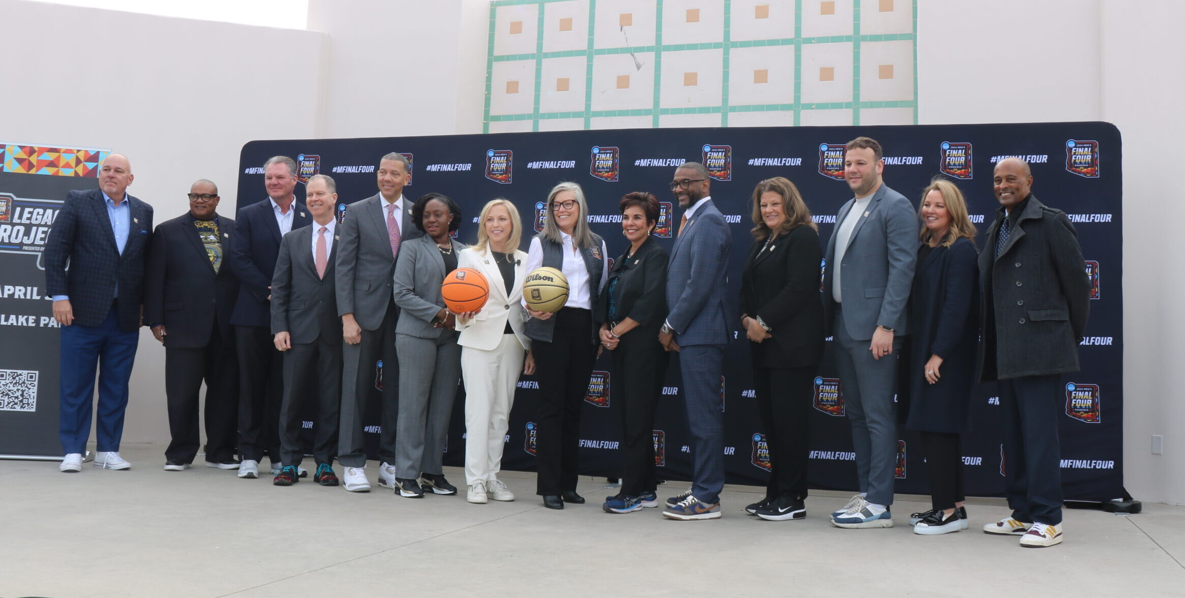 The panelists and NCAA Men's Final Four board members, highlighted by Arizona governor Katie Hobbs, pose for a picture after today's Men's Final Four Tip-Off presser.