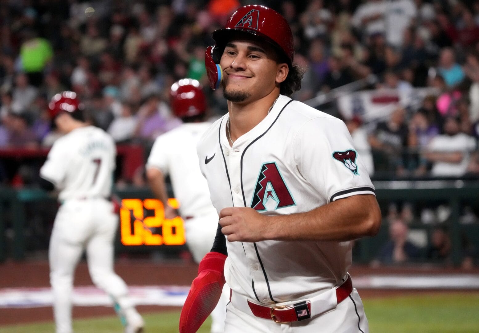 Alek Thomas scores a run against the Colorado Rockies.