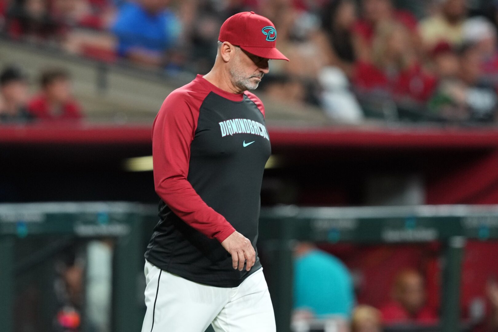 Arizona Diamondbacks manager Torey Lovullo walks onto the field against the Miami Marlins.