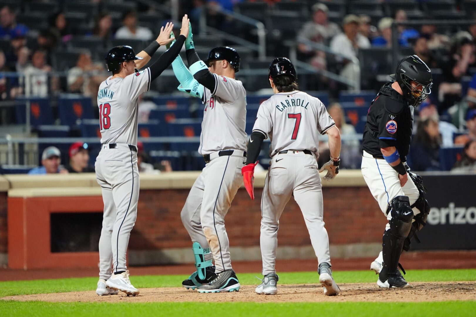 Arizona Diamondbacks DH Joc Pederson celebrates with Kevin Newman and Corbin Carroll after hitting a three-run home run