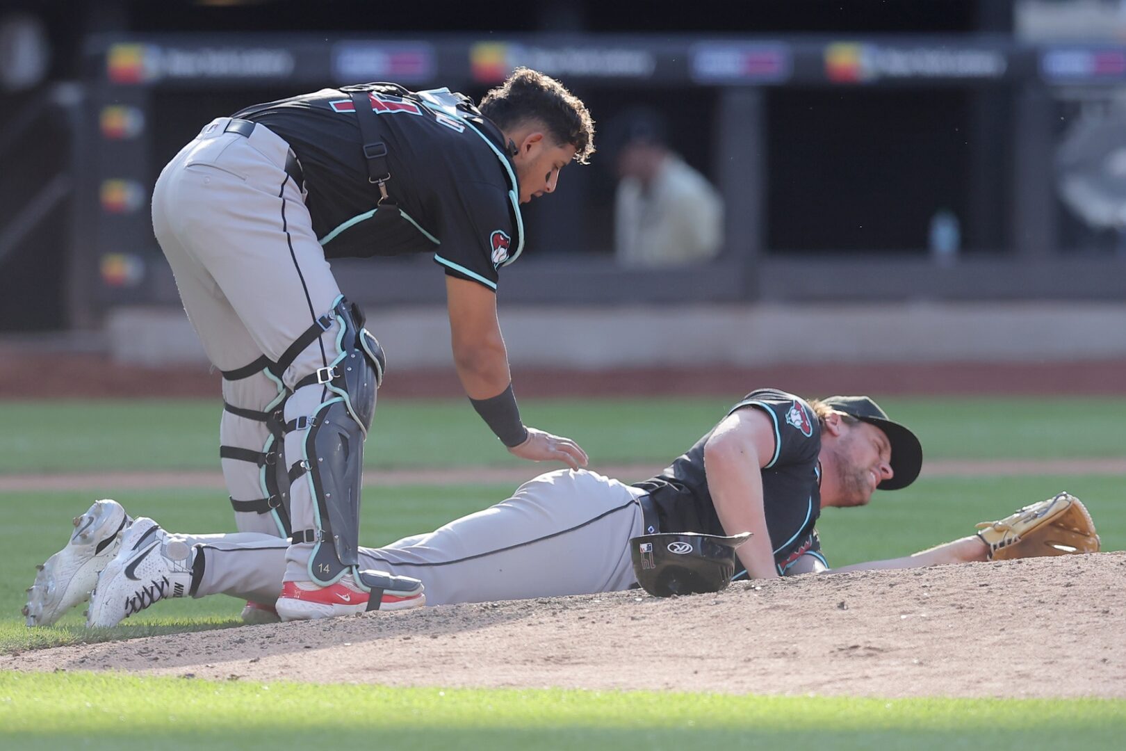 Diamondbacks catcher Gabriel Moreno checks on Kevin Ginkel.