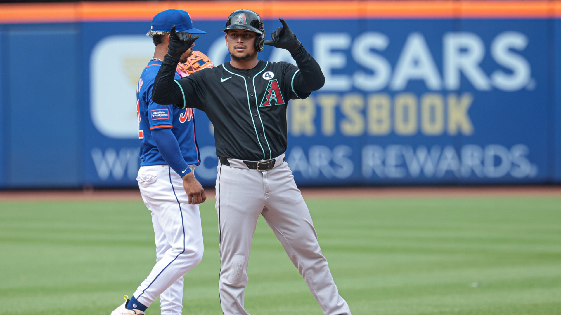 Gabriel Moreno celebrates at second base after hitting a double off Jake Diekman to lead off the ninth inning against the New York Mets at Citi Field.