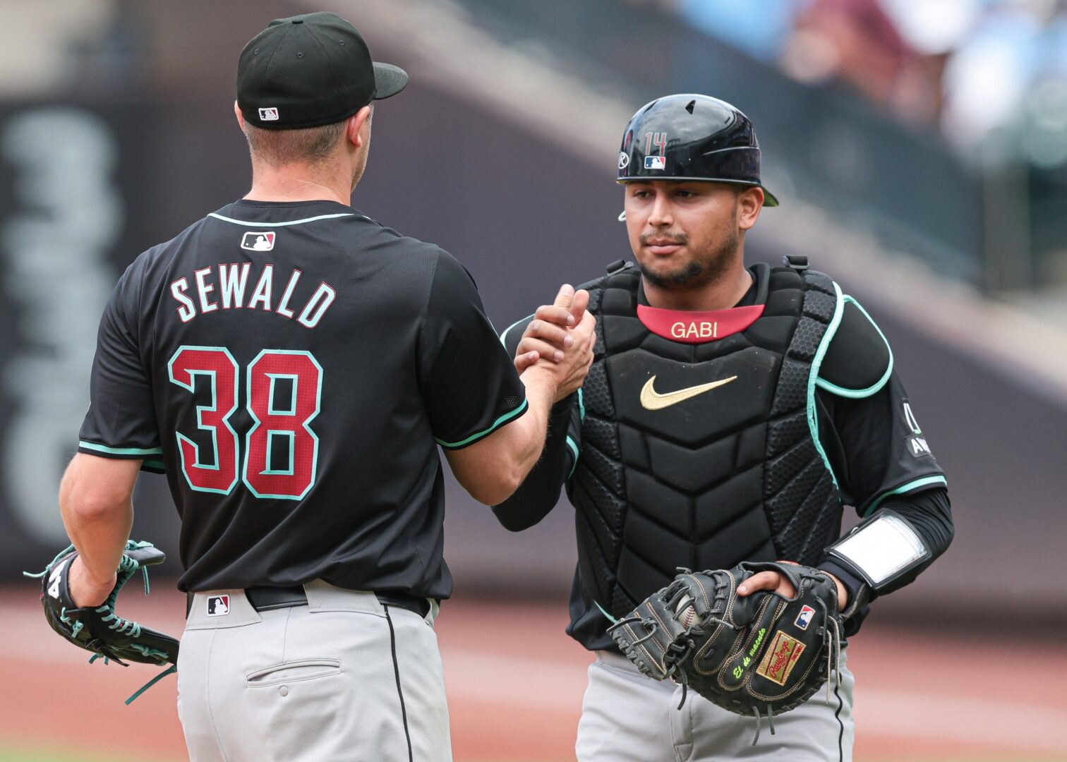 Arizona Diamondbacks closer Paul Sewald celebrates with Gabriel Moreno after locking down his 5th save of the season against the Mets.