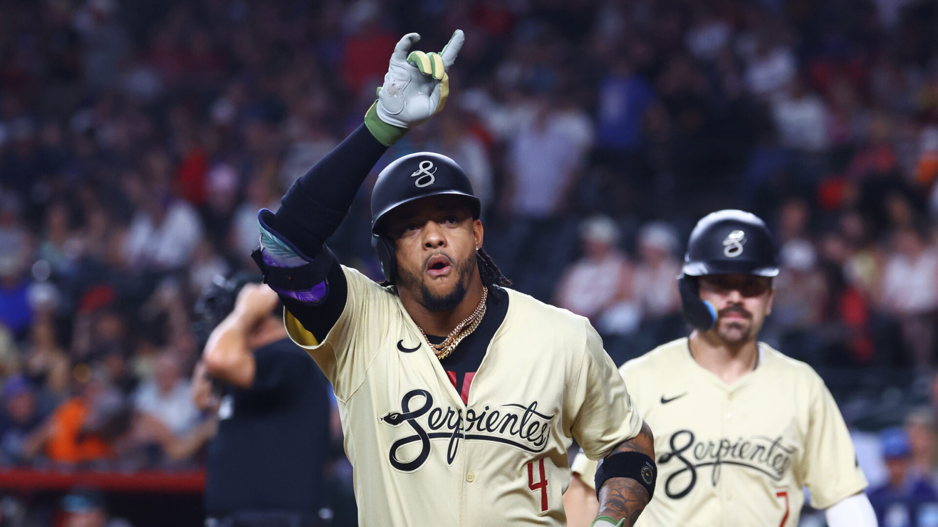 Diamondbacks second baseman Ketel Marte gestures back to his own dugout after hitting a two-run home run in the first inning against the Minnesota Twins.