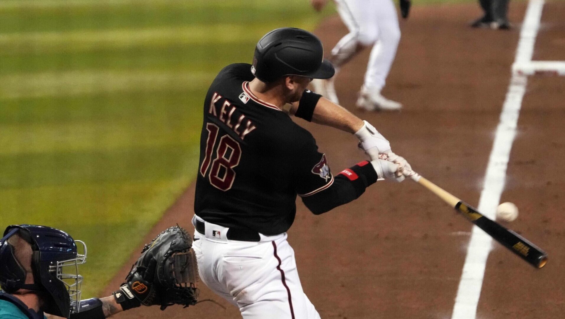 Carson Kelly bats for the Arizona Diamondbacks at Chase Field.