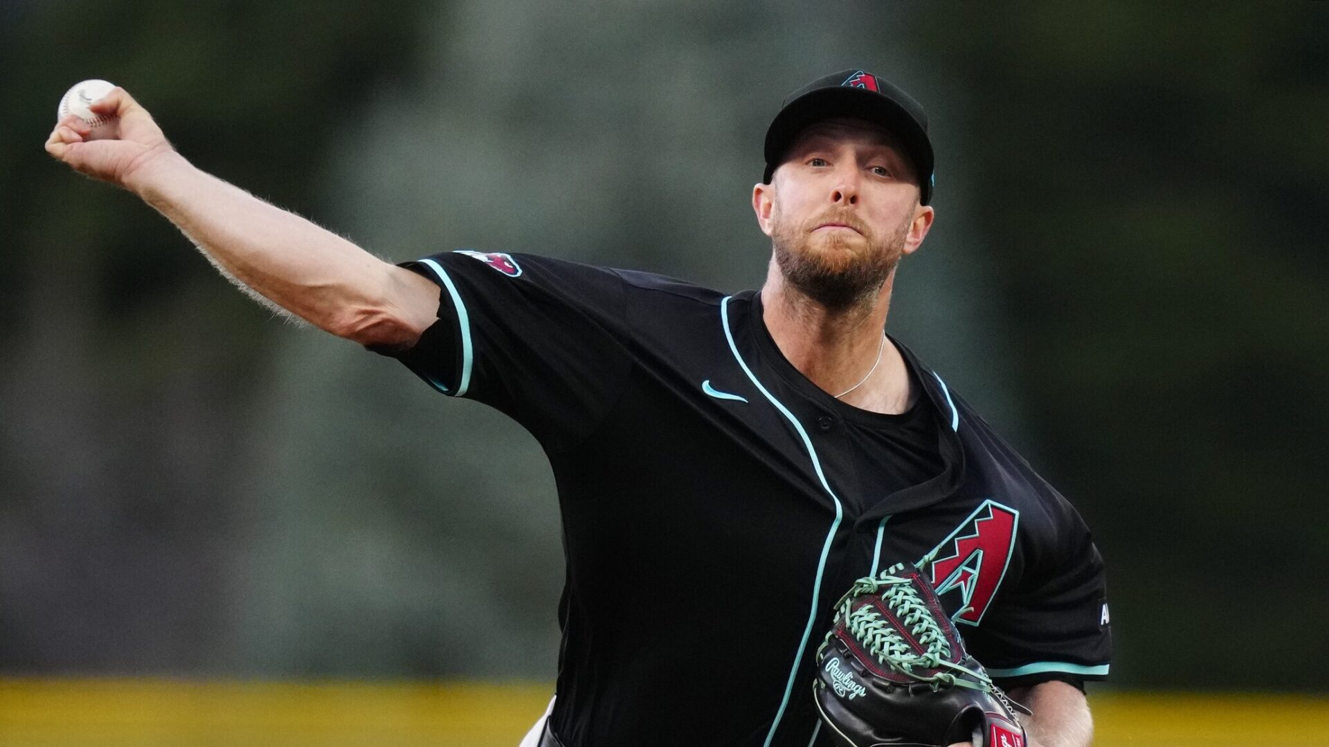 Diamondbacks right-hander Merrill Kelly pitches against the Colorado Rockies at Coors Field.