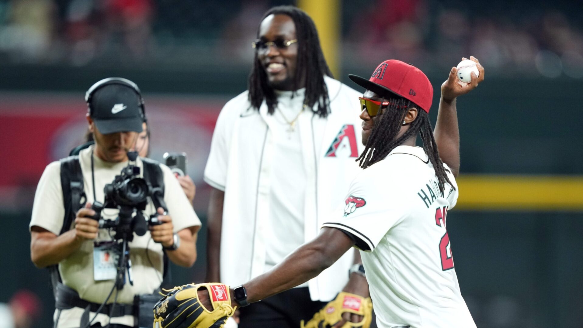 Arizona Cardinals first rounders Darius Robinson and Marvin Harrison Jr. throw out the ceremonial first pitch at Chase Field