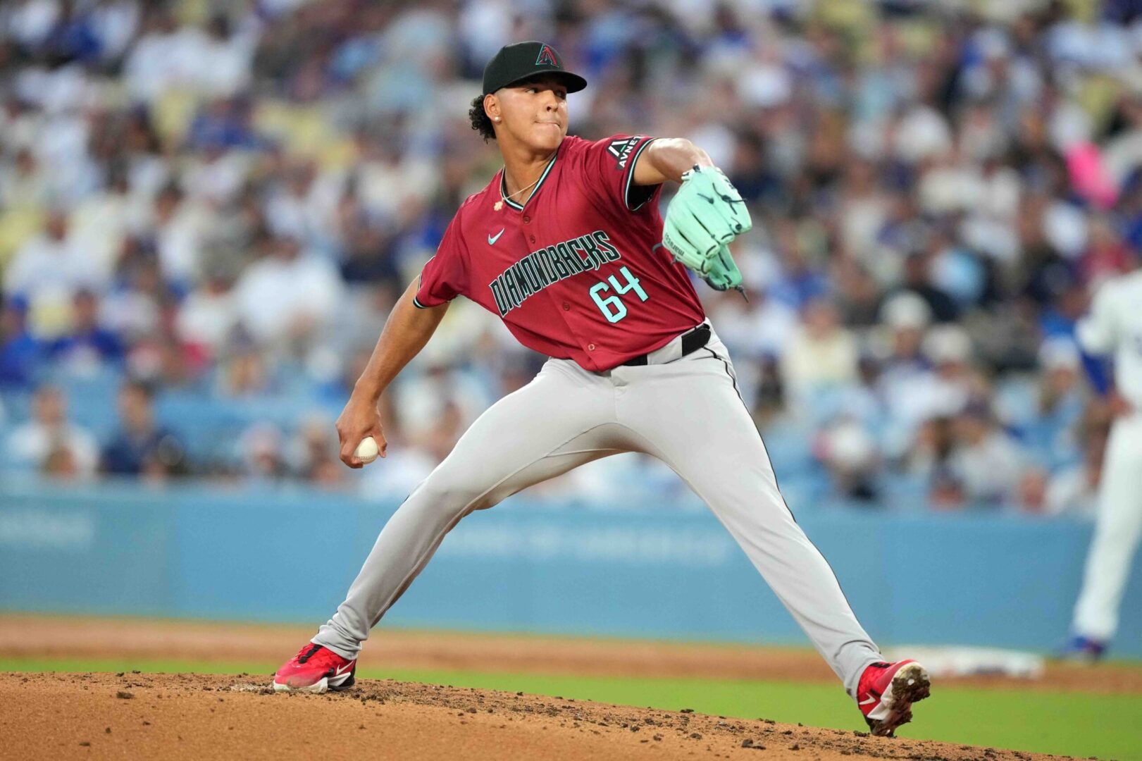 Diamondbacks right-hander Cristian Mena pitches against the Los Angeles Dodgers in his major league debut at Dodger Stadium.