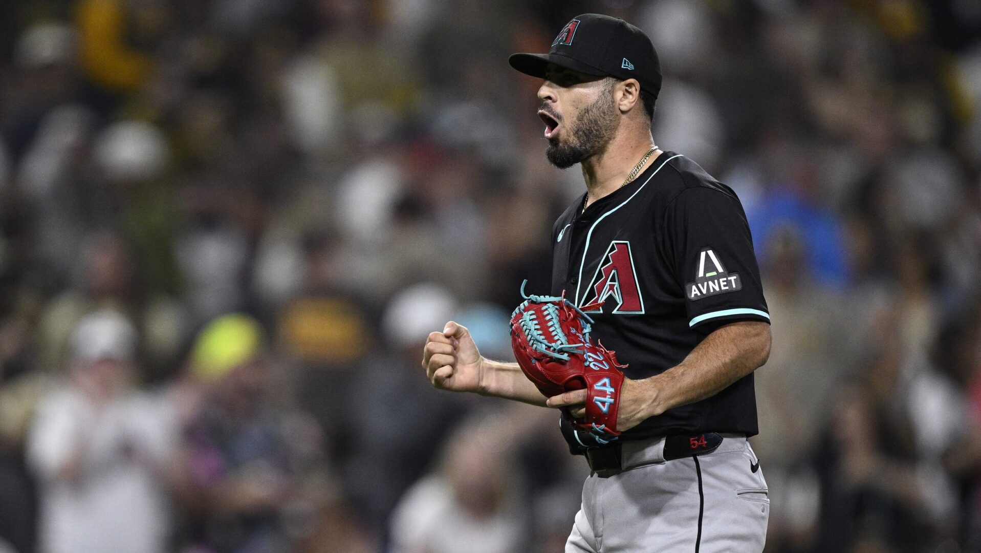 Diamondbacks reliever Humberto Castellanos celebrates after recording his first career save against the San Diego Padres.