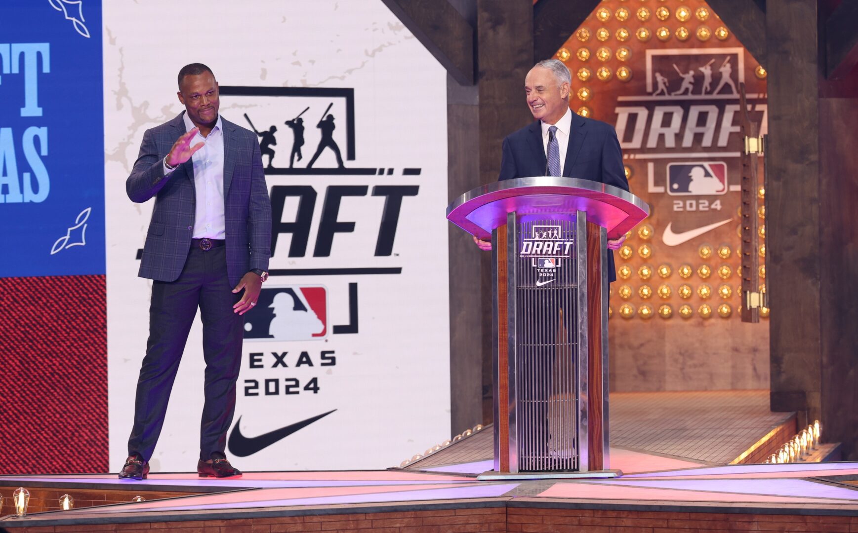 Adrian Beltre and Rob Manfred at the podium at the start of the 2024 MLB Draft.