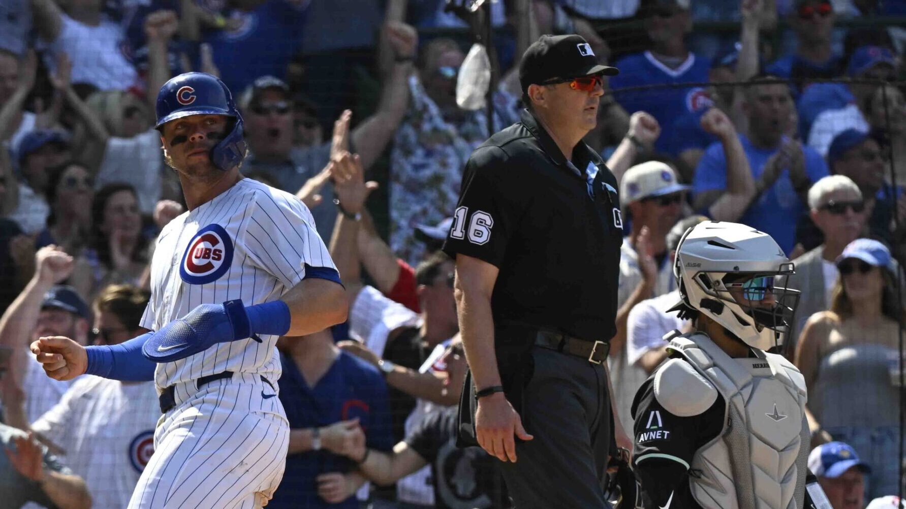 Cubs second baseman Nico Hoerner scores the tying run against the Diamondbacks.