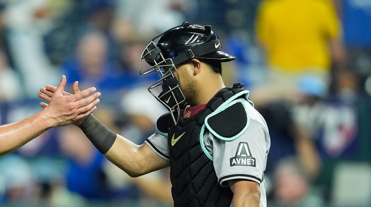 Arizona Diamondbacks catcher Gabriel Moreno celebrates a 6-2 win over the Royals with right-hander Kevin Ginkel.
