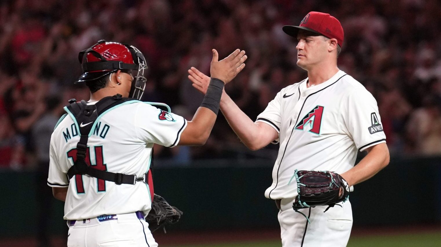 Arizona Diamondbacks closer Paul Sewald and catcher Gabriel Moreno celebrate a win over the Pittsburgh Pirates at Chase Field.