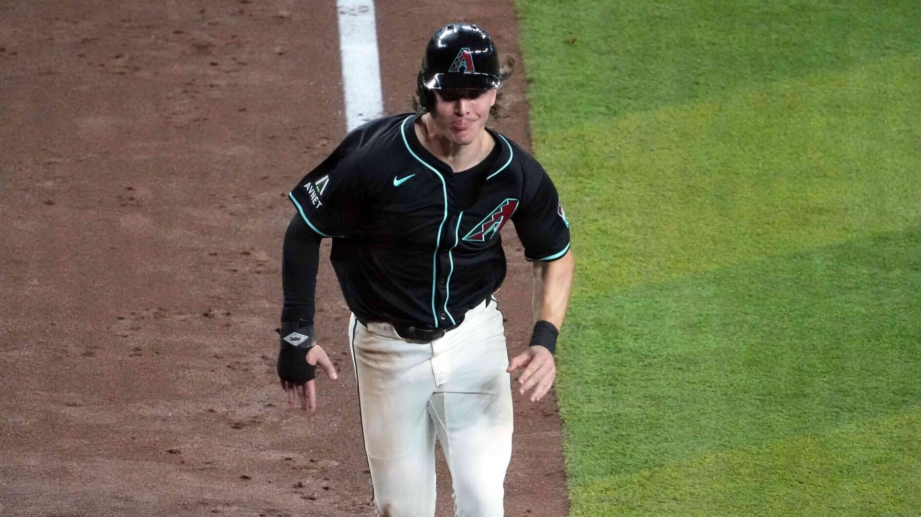 Diamondbacks center fielder Jake McCarthy scores on a Geraldo Perdomo sacrifice fly.