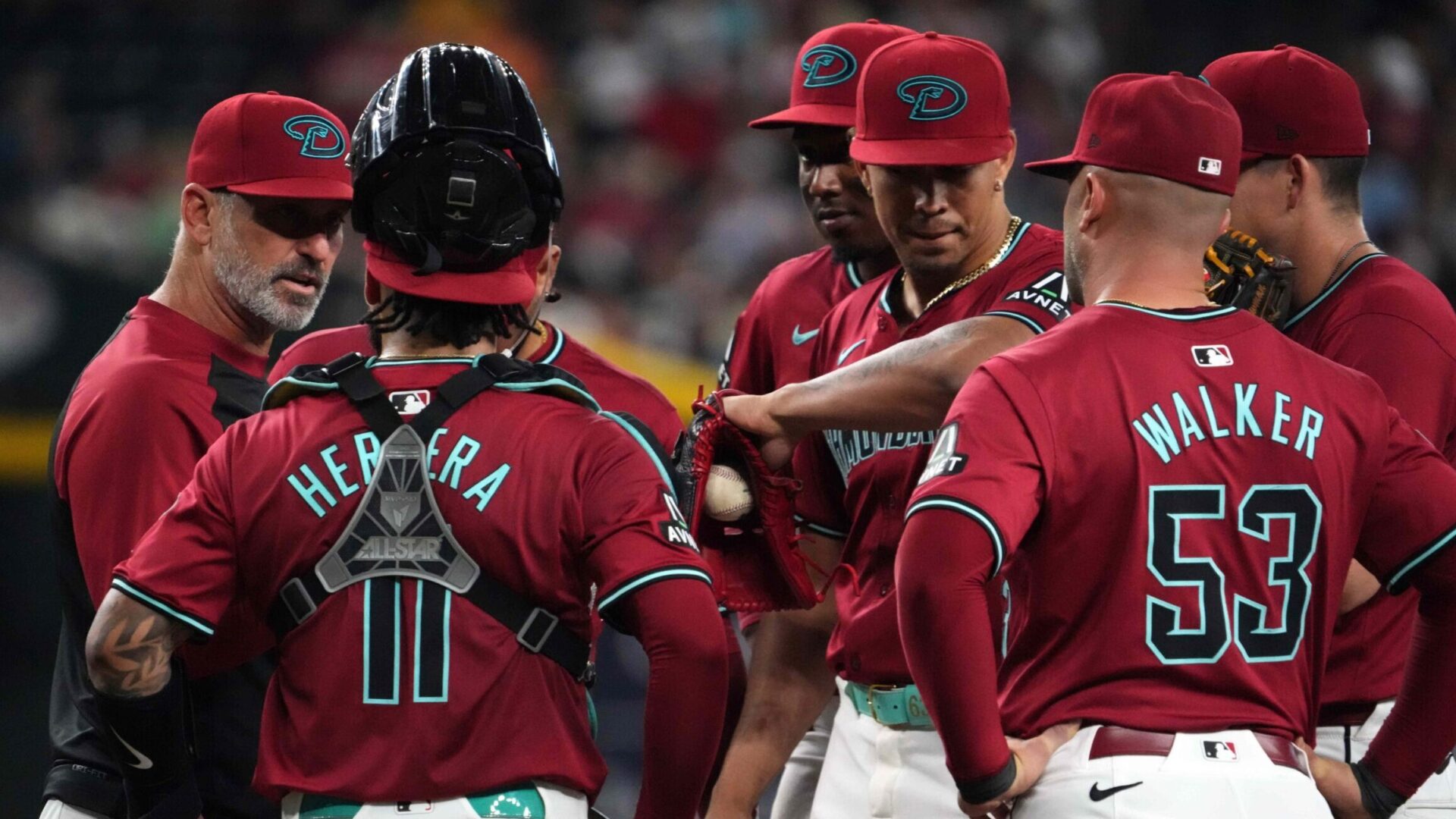 The Diamondbacks meet at the mound against the Pirates at Chase Field.