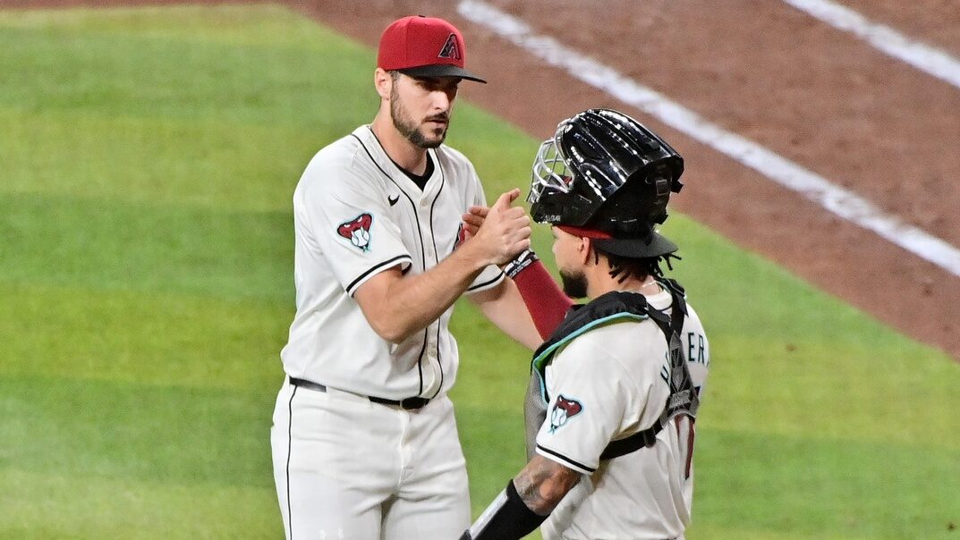 Diamondbacks right-hander Ryan Thompson and catcher Jose Herrera shake hands after defeating the Washington Nationals at Chase Field 5-4.
