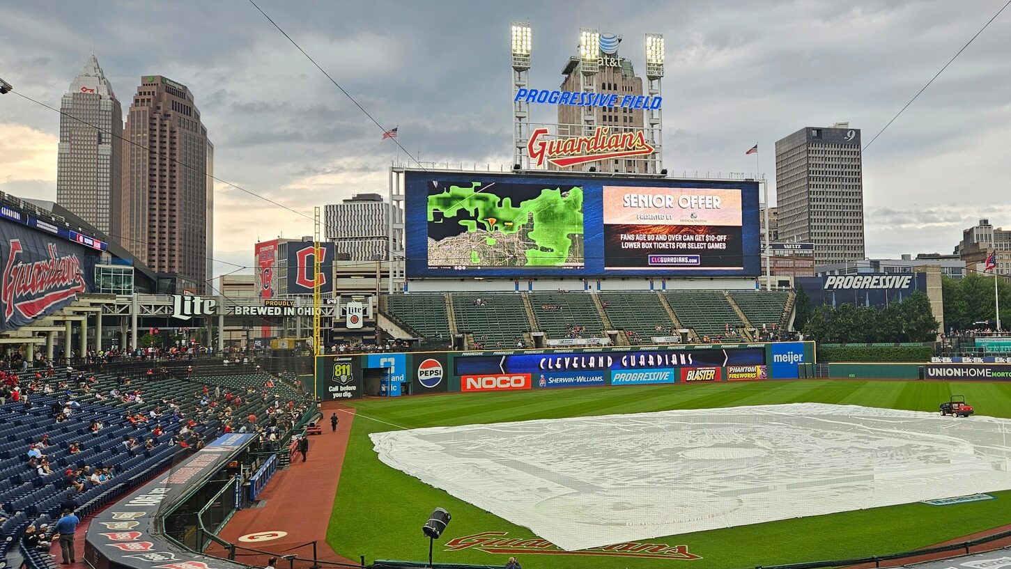 A shot of Progressive Field, with the tarp on the field. The Diamondbacks and Guardians game was postponed due to weather.