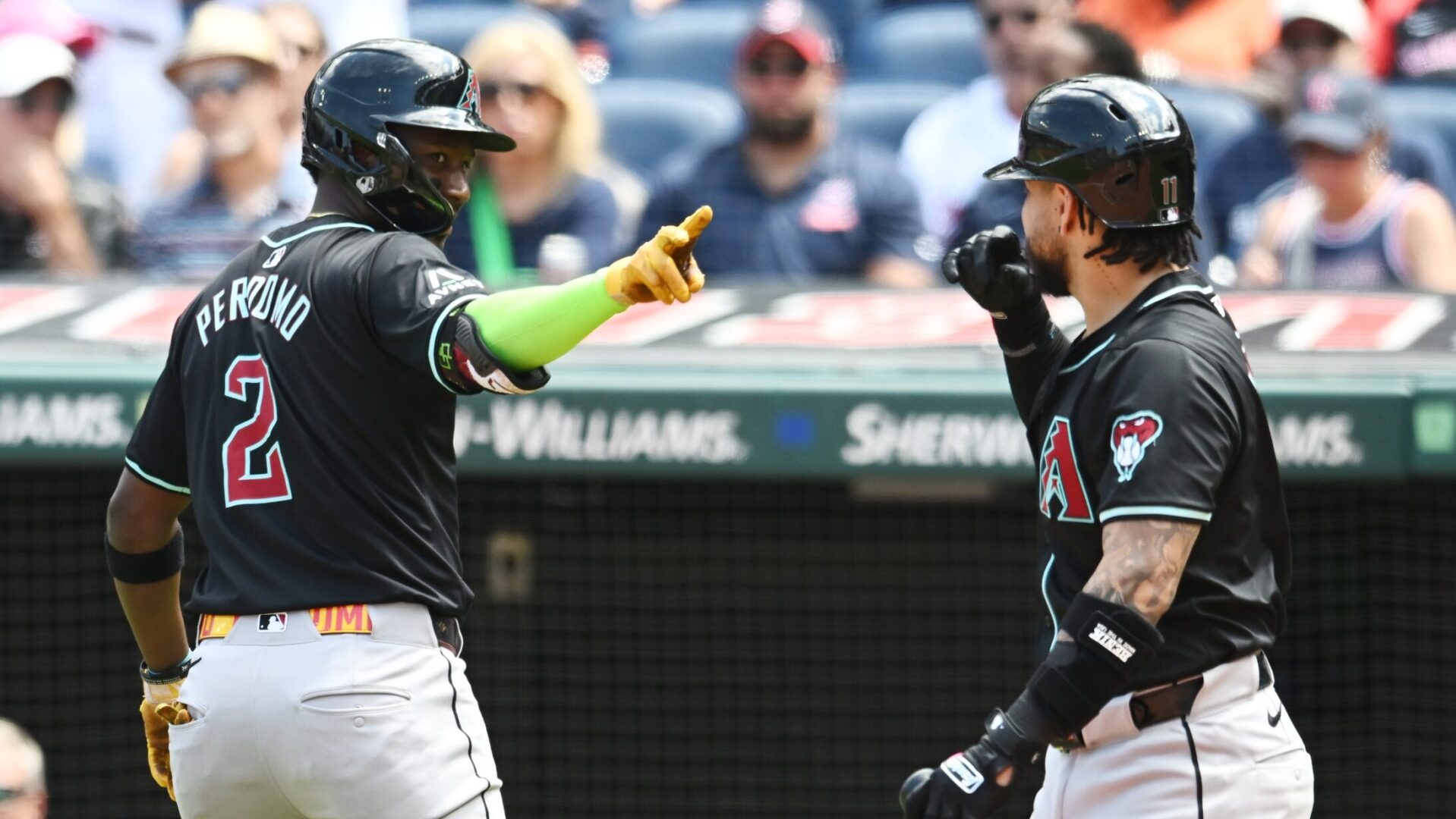 Diamondbacks shortstop Geraldo Perdomo talks to catcher Jose Herrera after hitting a home run against the Cleveland Guardians at Progressive Field.