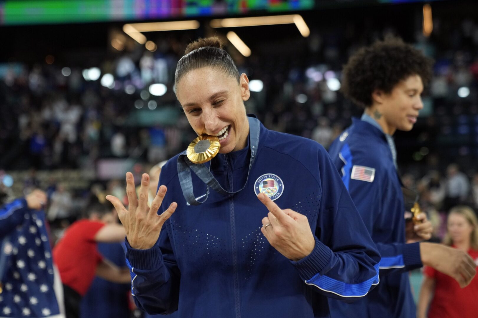 Aug 11, 2024; Paris, France; United States shooting guard Diana Taurasi (12) celebrates after the receiving the gold medal in women’s basketball during the Paris 2024 Olympic Summer Games at Accor Arena. Mandatory Credit: Kyle Terada-USA TODAY Sports