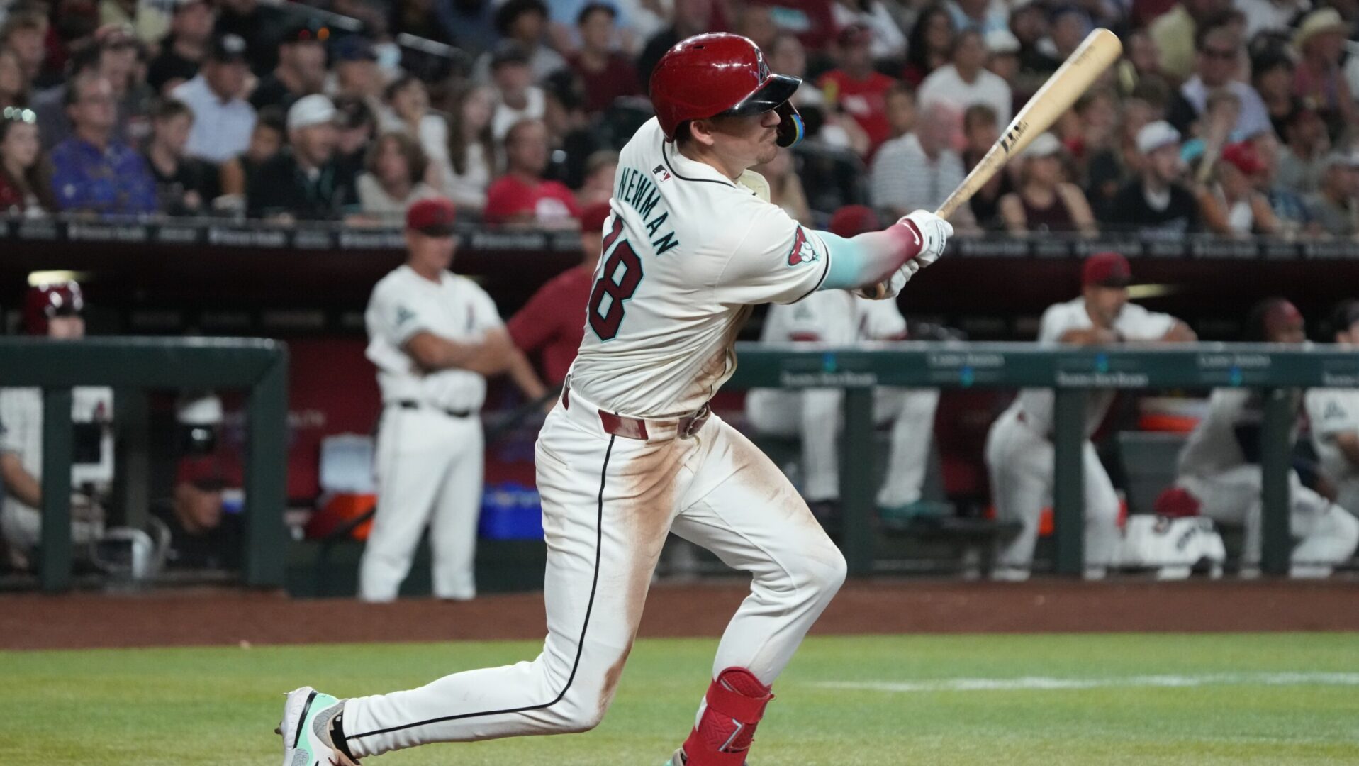 Diamondbacks second baseman Kevin Newman bats against the Philadelphia Phillies at Chase Field.