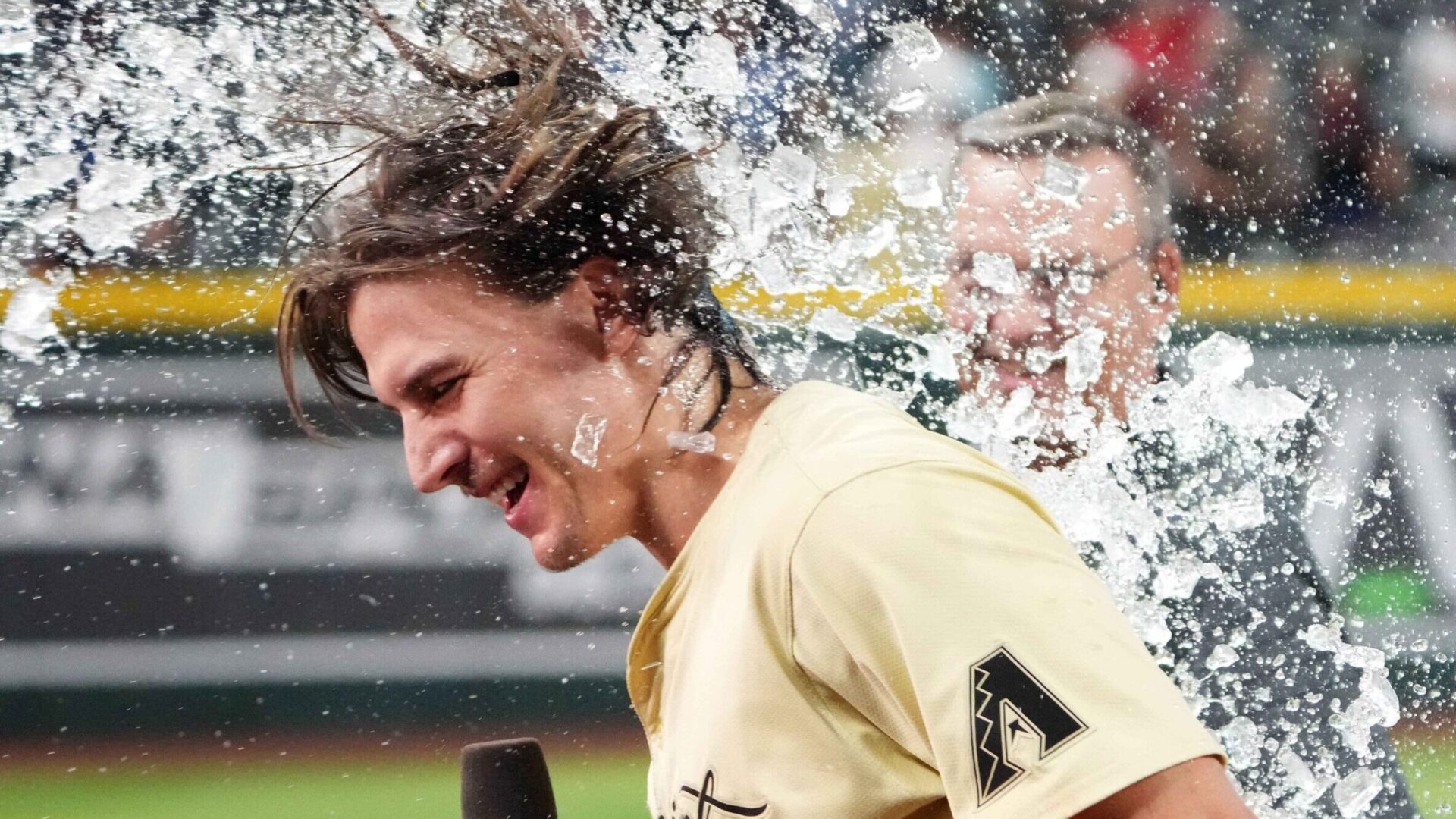 Jake McCarthy gets showered in Gatorade while discussing his walk-off hit on the Diamondbacks TV broadcast.