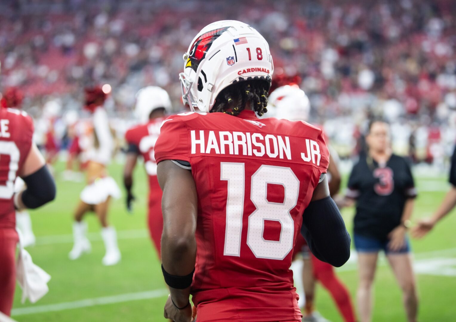 Aug 10, 2024; Glendale, Arizona, USA; Detailed view of the jersey of Arizona Cardinals wide receiver Marvin Harrison Jr. (18) against the New Orleans Saints during a preseason NFL game at State Farm Stadium. Mandatory Credit: Mark J. Rebilas-USA TODAY Sports