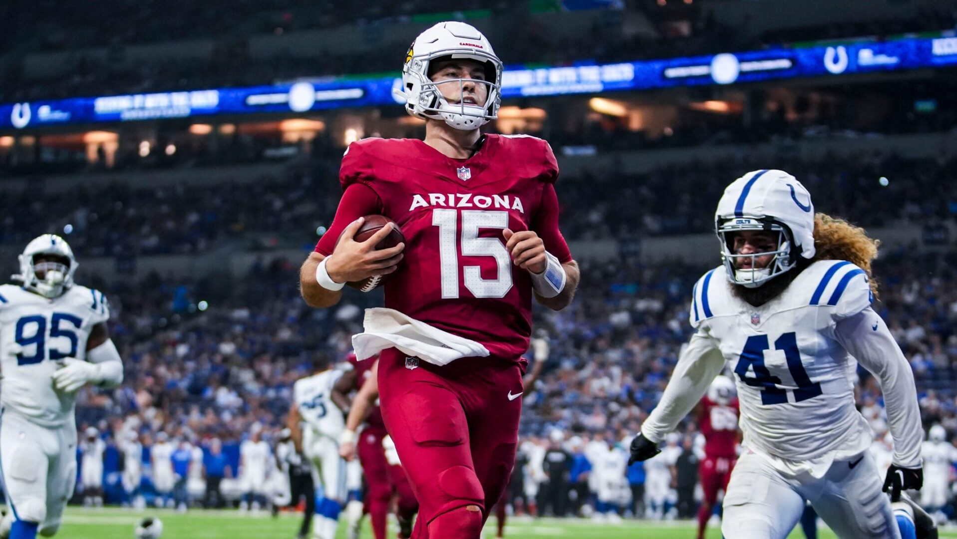 Arizona Cardinals quarterback Clayton Tune scores a touchdown against the Indianapolis Colts at Lucas Oil Stadium.