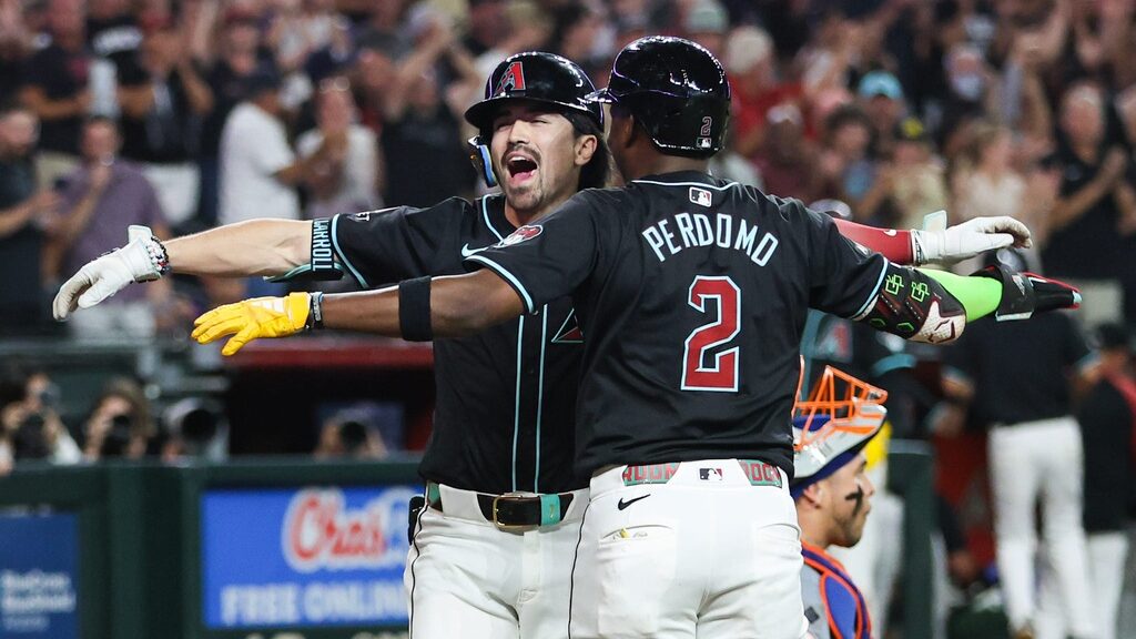 Diamondbacks right fielder Corbin Carroll celebrates with Geraldo Perdomo after hitting a go-ahead grand slam against the Mets at Chase Field.