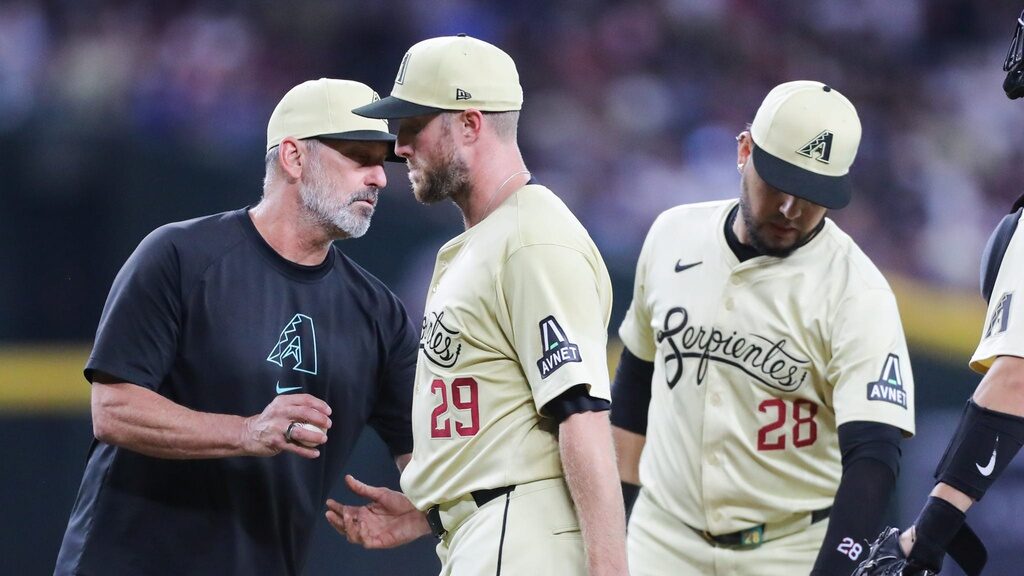 Diamondbacks manager Torey Lovullo takes starting pitcher Merrill Kelly out of the game against the Los Angeles Dodgers.