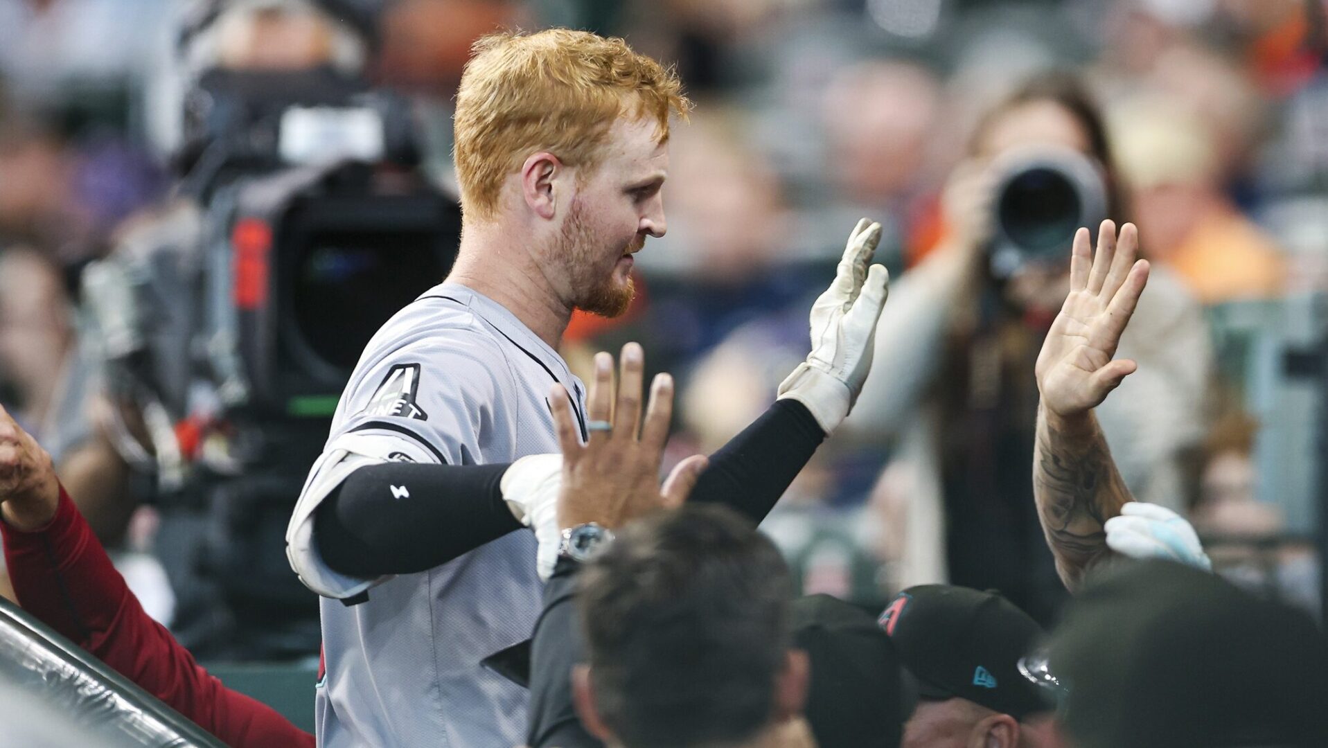 Diamondbacks left fielder Pavin Smith celebrates in the dugout after hitting a home run against Justin Verlander.