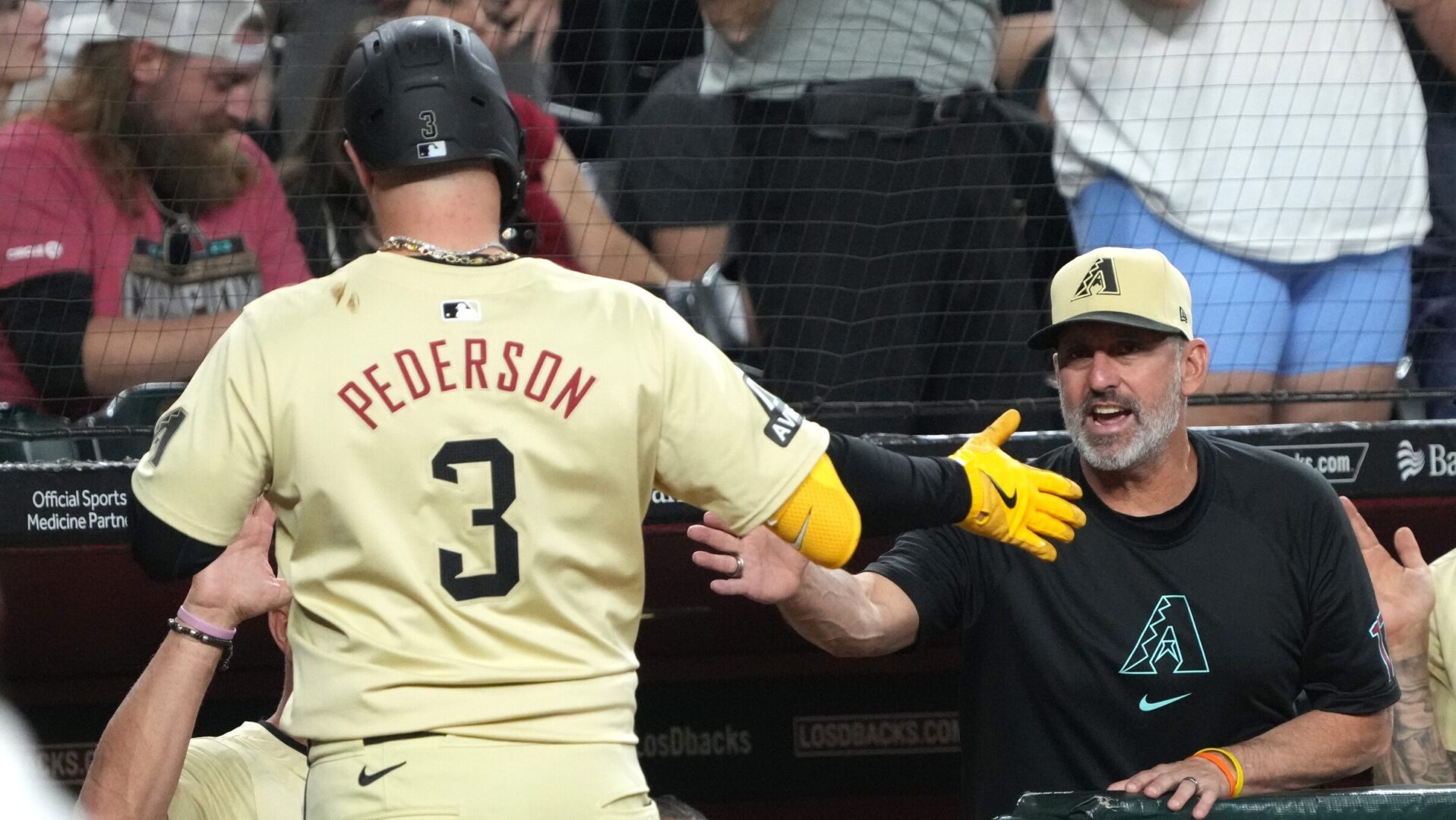 Diamondbacks designated hitter Joc Pederson celebrates with manager Torey Lovullo.