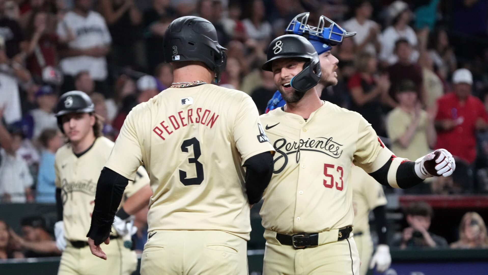 Diamondbacks first baseman Christian Walker celebrates with Joc Pederson after hitting a two-run homer.