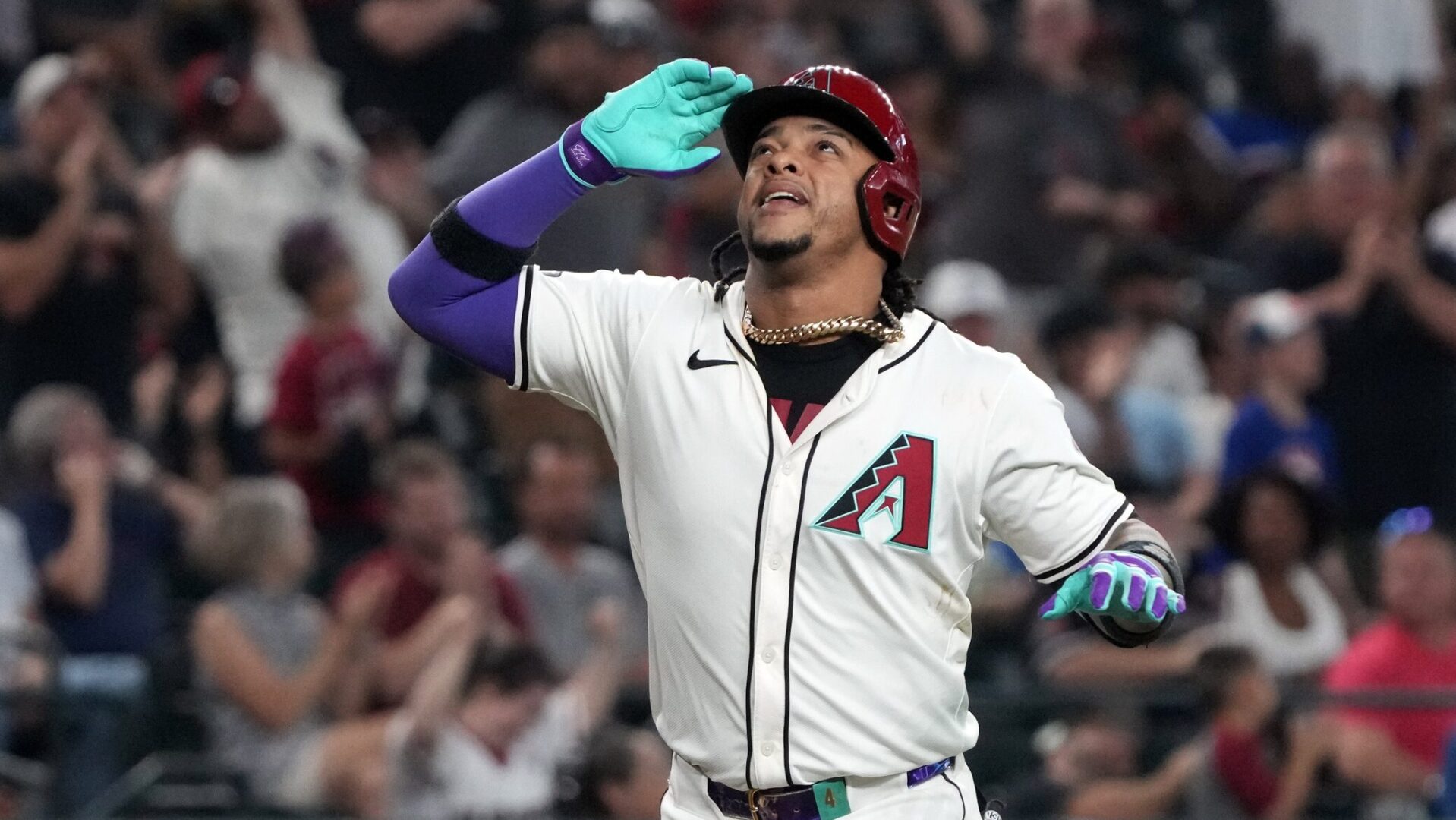 Diamondbacks second baseman Ketel Marte celebrates after hitting a three-run home run against the Texas Rangers.