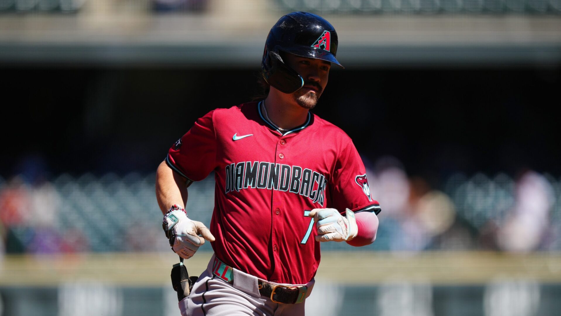 Diamondbacks outfielder Corbin Carroll rounds the bases after hitting a home run against the Colorado Rockies.