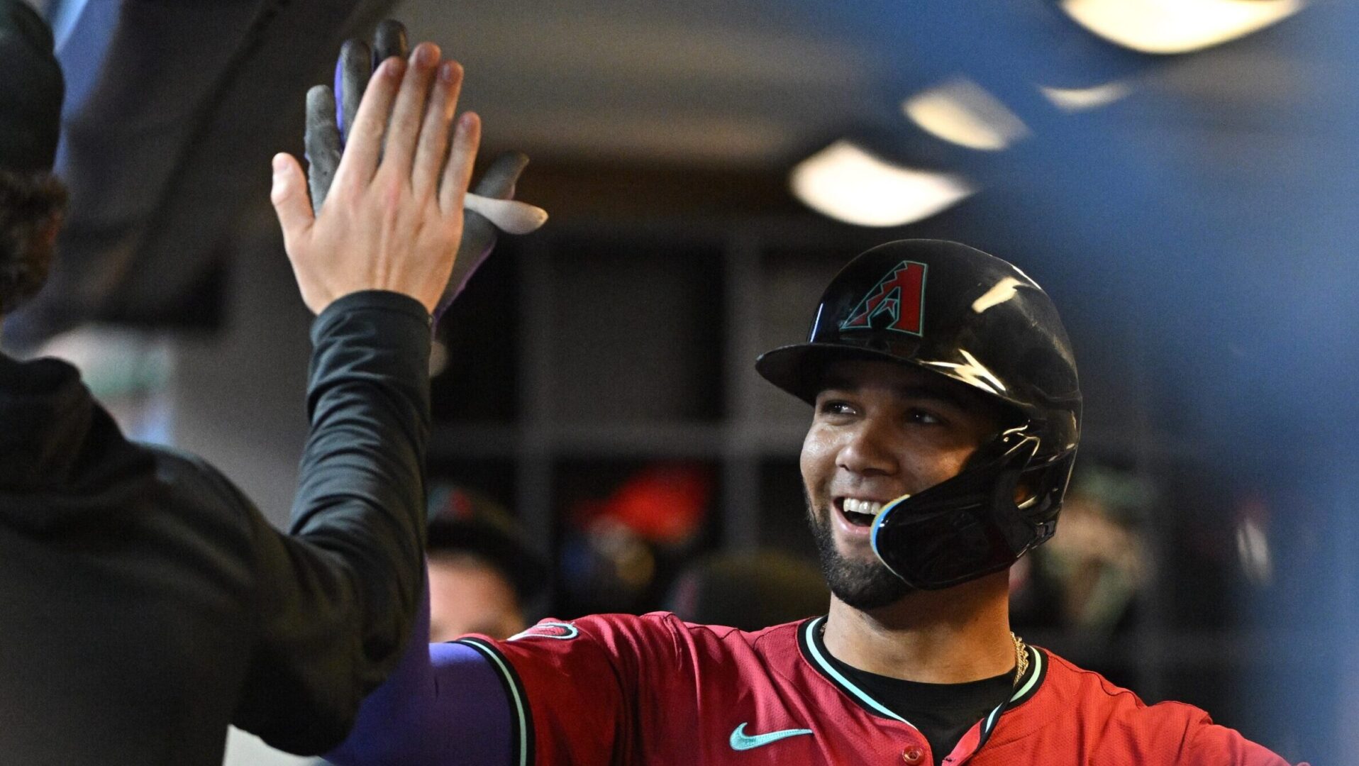 Diamondbacks left fielder Lourdes Gurriel Jr. celebrates in the dugout after hitting a go-ahead home run.