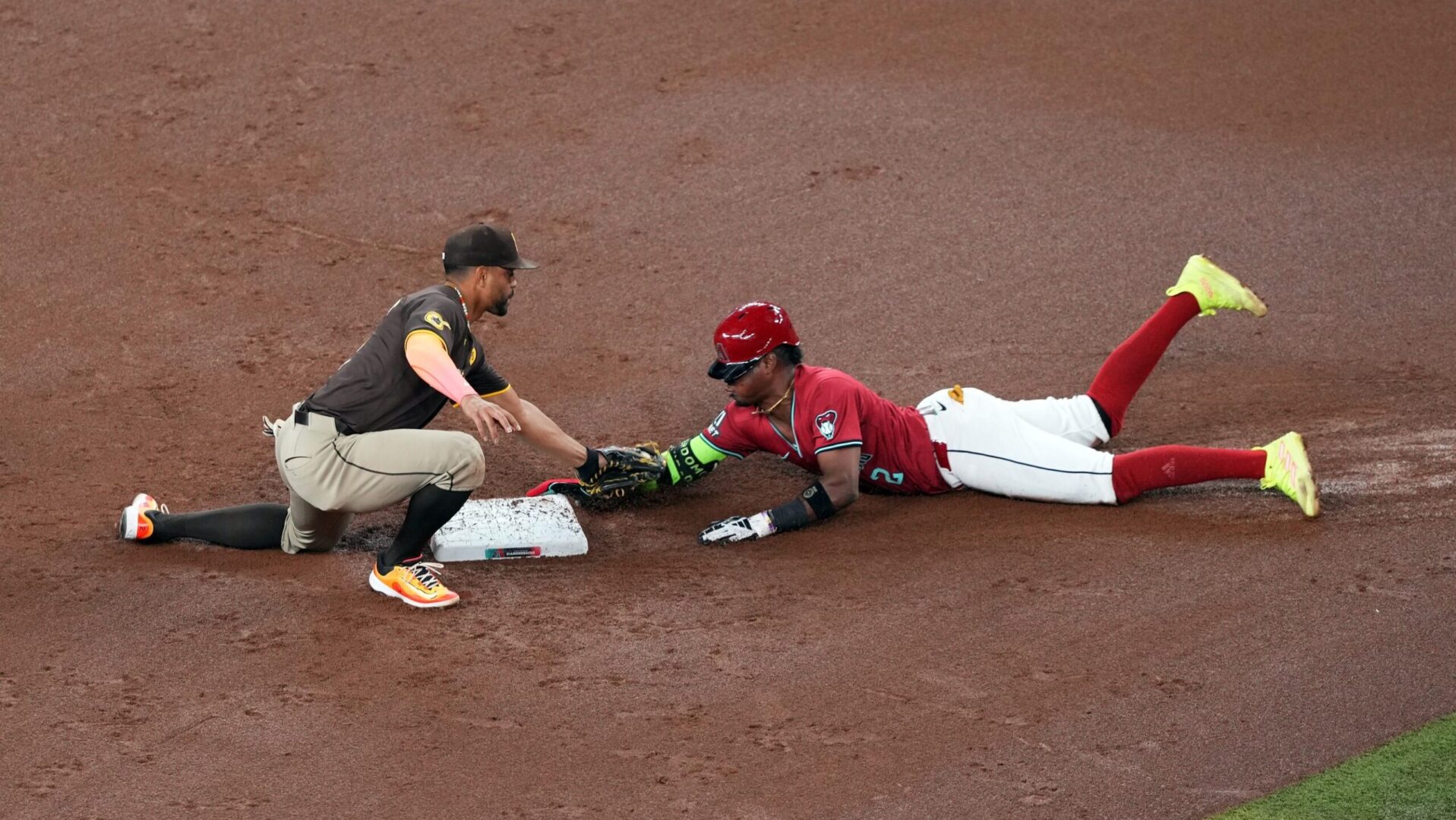 Diamondbacks shortstop Geraldo Perdomo slides in safely on a stolen base.