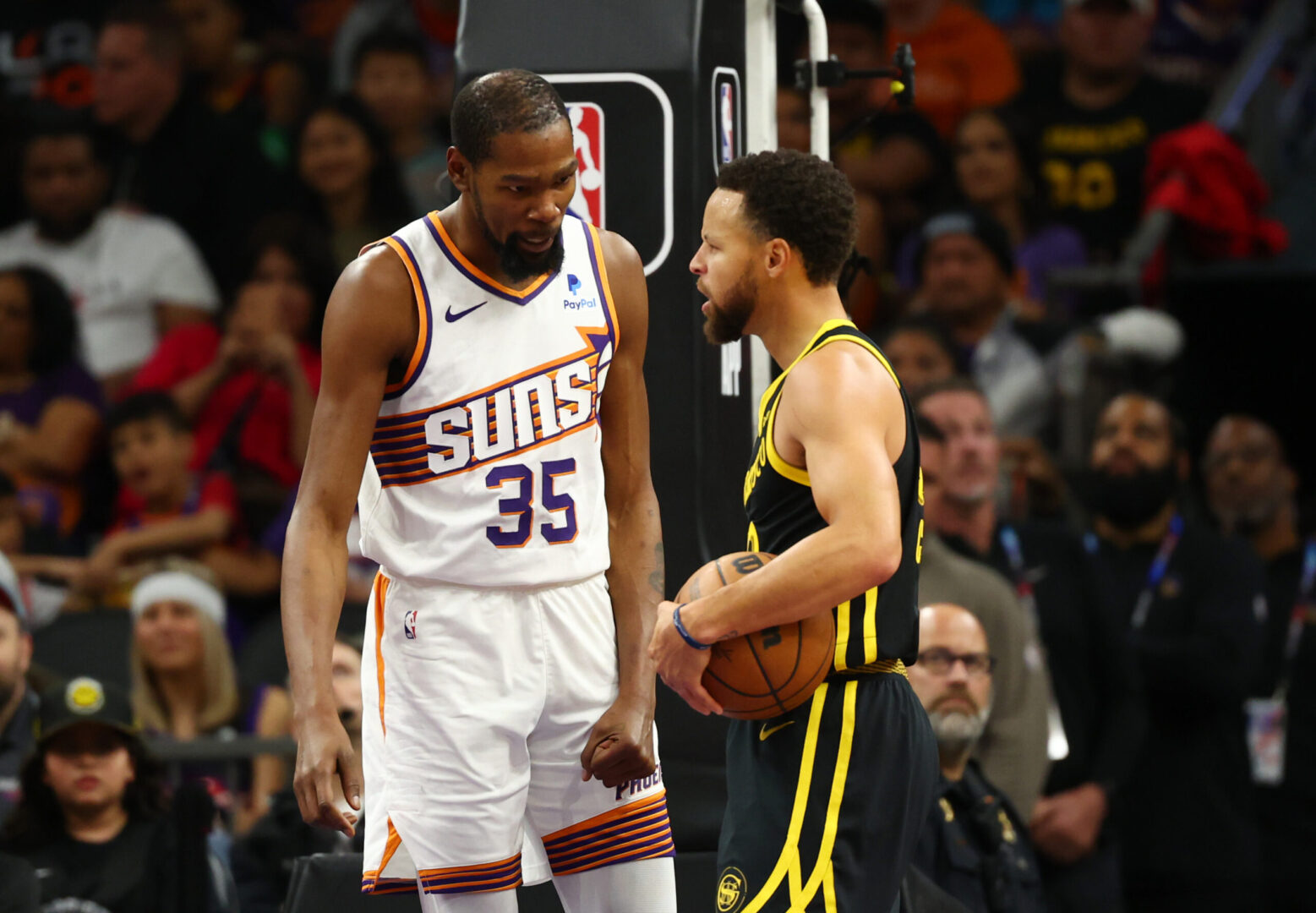 Nov 22, 2023; Phoenix, Arizona, USA; Phoenix Suns forward Kevin Durant (35) talks to Golden State Warriors guard Stephen Curry after a foul in the first half at Footprint Center. Mandatory Credit: Mark J. Rebilas-Imagn Images