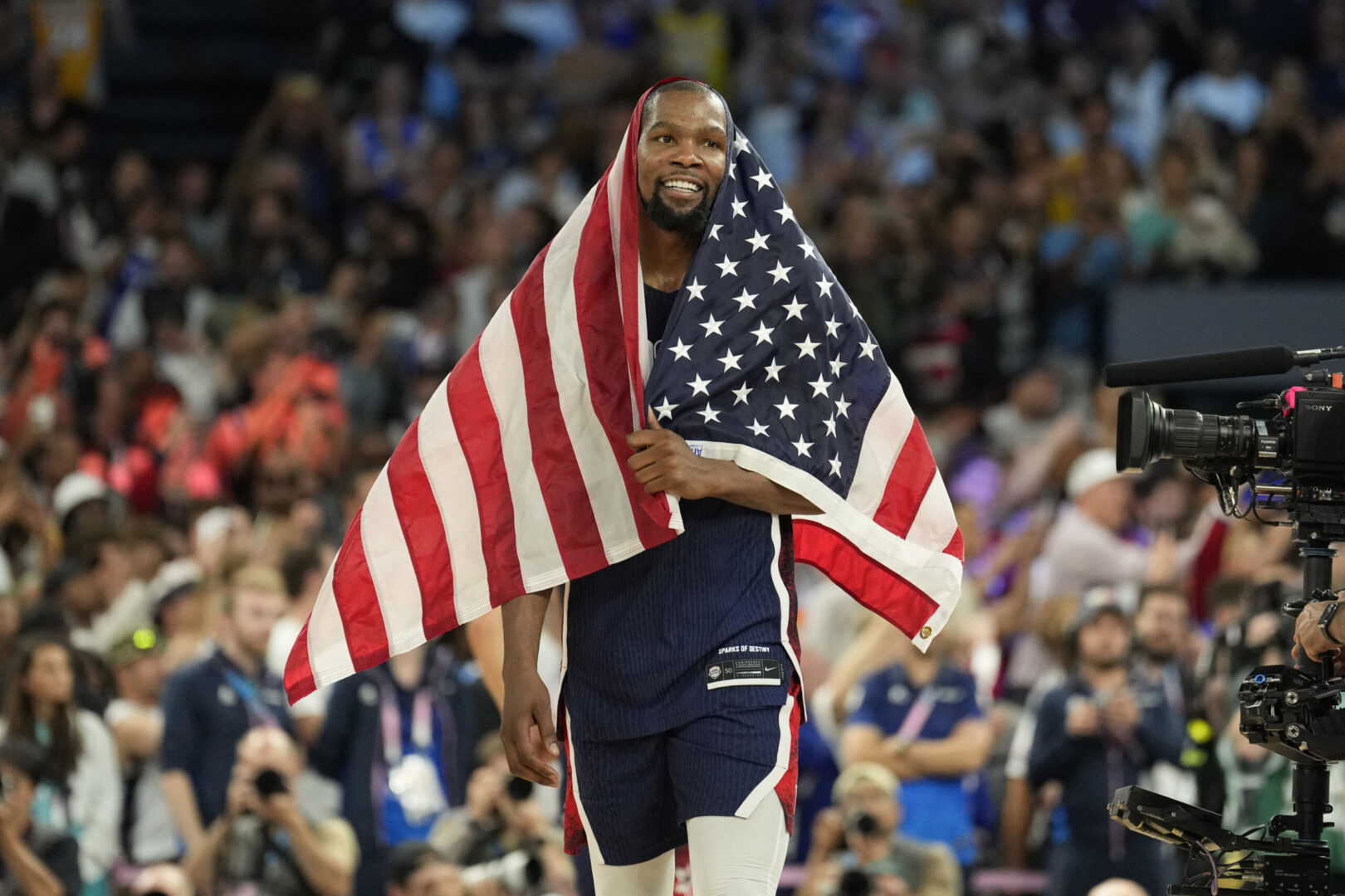 Aug 10, 2024; Paris, France; United States guard Kevin Durant (7) celebrates after defeating France in the men's basketball gold medal game during the Paris 2024 Olympic Summer Games at Accor Arena. Mandatory Credit: Kyle Terada-Imagn Images