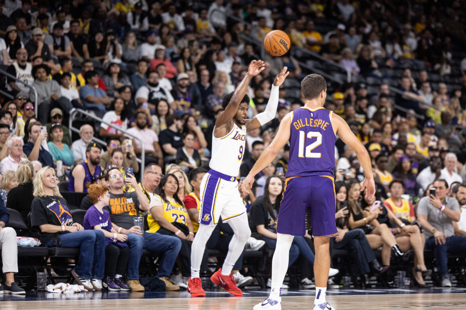 Oct 6, 2024; Palm Desert, California, USA; Los Angeles Lakers guard Bronny James (9) in bounds the ball against Phoenix Suns guard Collin Gillespie (12) during the second half at Acrisure Arena. Mandatory Credit: David Frerker-Imagn Images