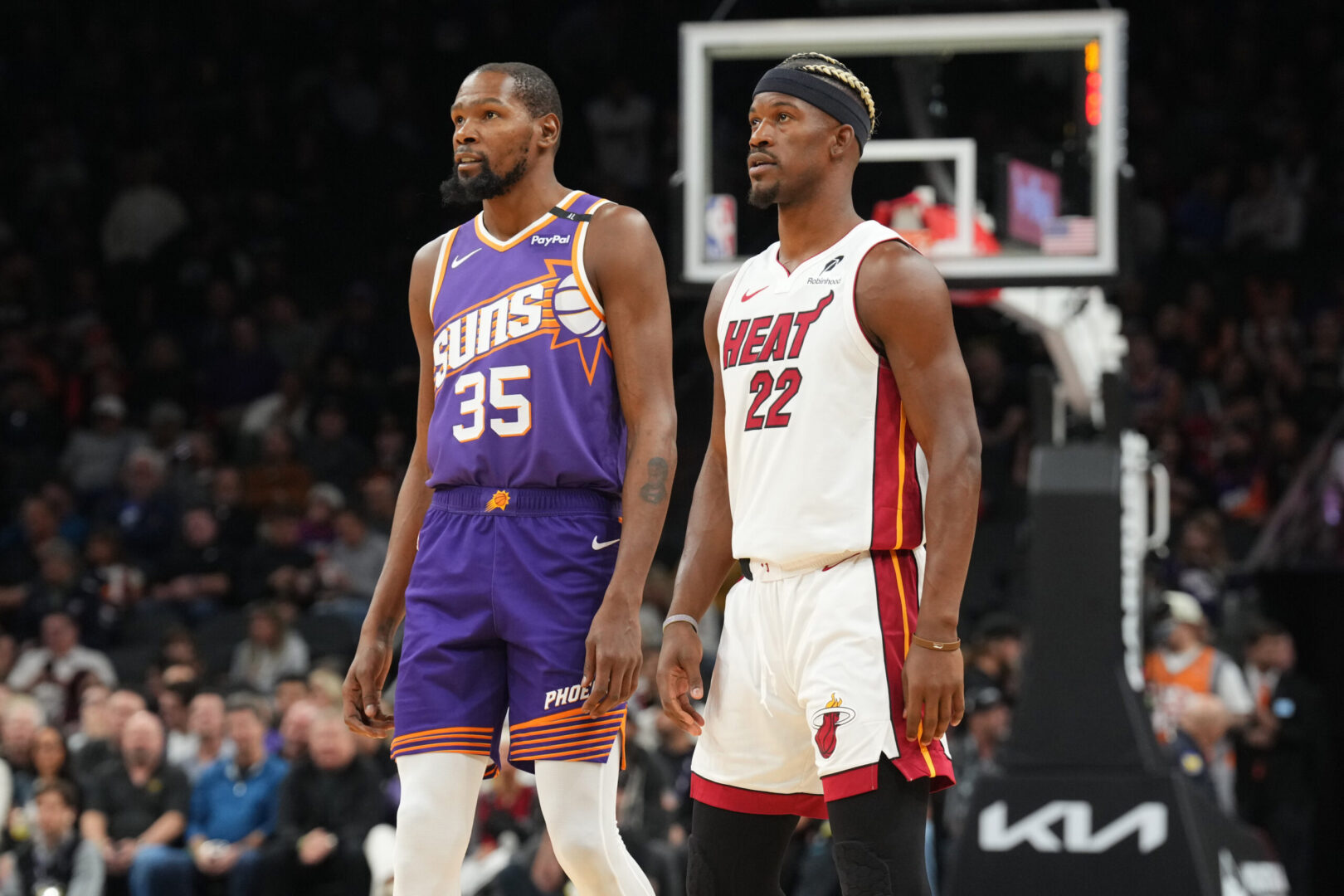 Nov 6, 2024; Phoenix, Arizona, USA; Phoenix Suns forward Kevin Durant (35) and Miami Heat forward Jimmy Butler (22) look on during the first half at Footprint Center. Mandatory Credit: Joe Camporeale-Imagn Images