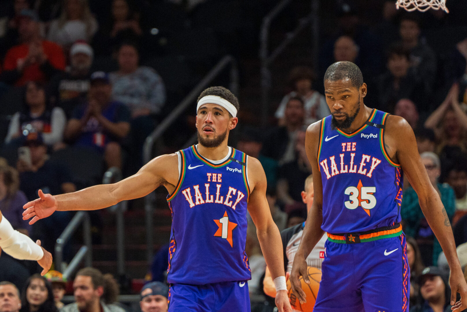 Dec 15, 2024; Phoenix, Arizona, USA; Phoenix Suns guard Devin Booker (1) and forward Kevin Durant (35) react after a time out in the second half during a game against the Portland Trail Blazers at Footprint Center. Mandatory Credit: Allan Henry-Imagn Images