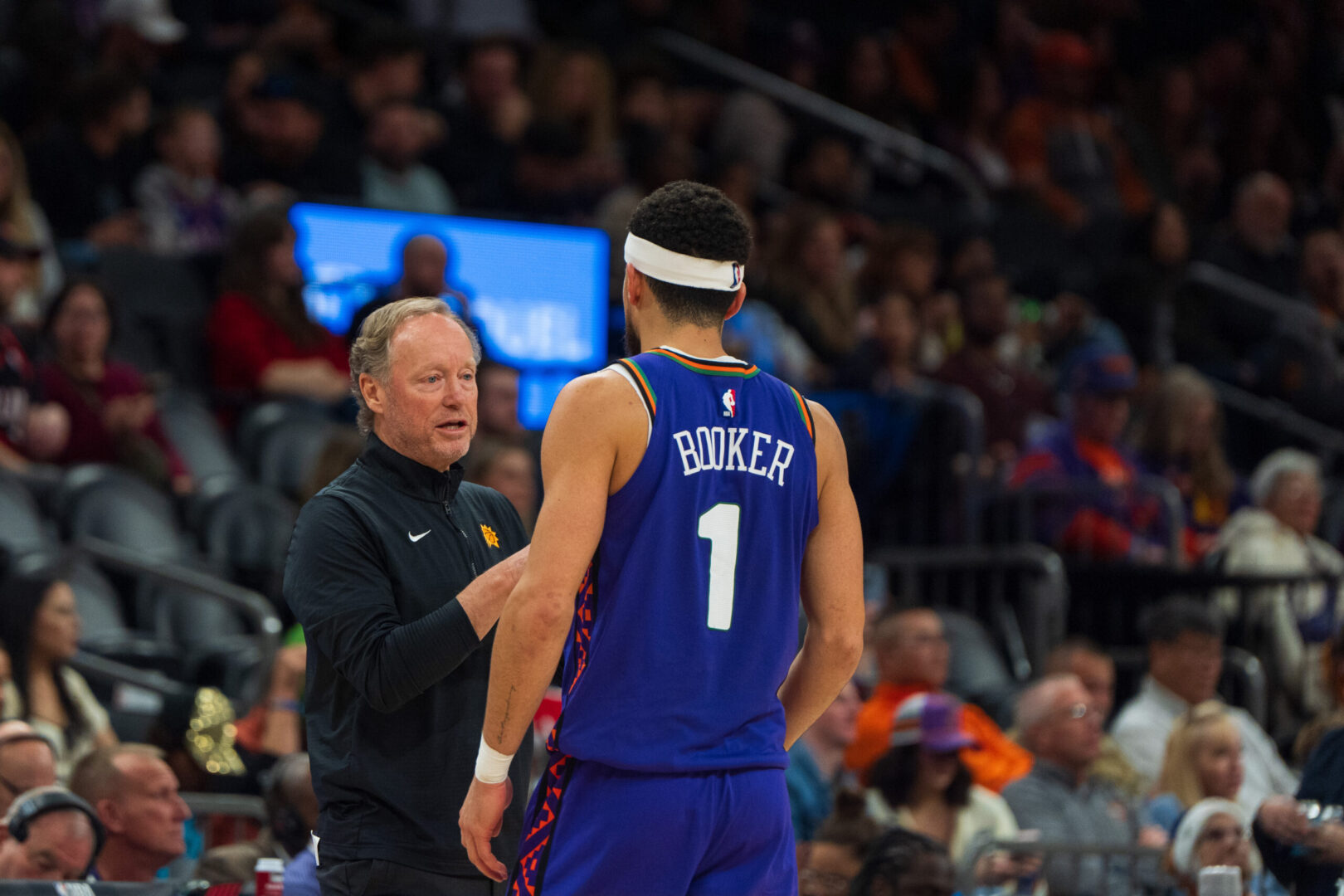 Dec 15, 2024; Phoenix, Arizona, USA; Phoenix Suns guard Devin Booker (1) and coach Mike Budenholzer between plays in the second half during a game against the Portland Trail Blazers at Footprint Center. Mandatory Credit: Allan Henry-Imagn Images