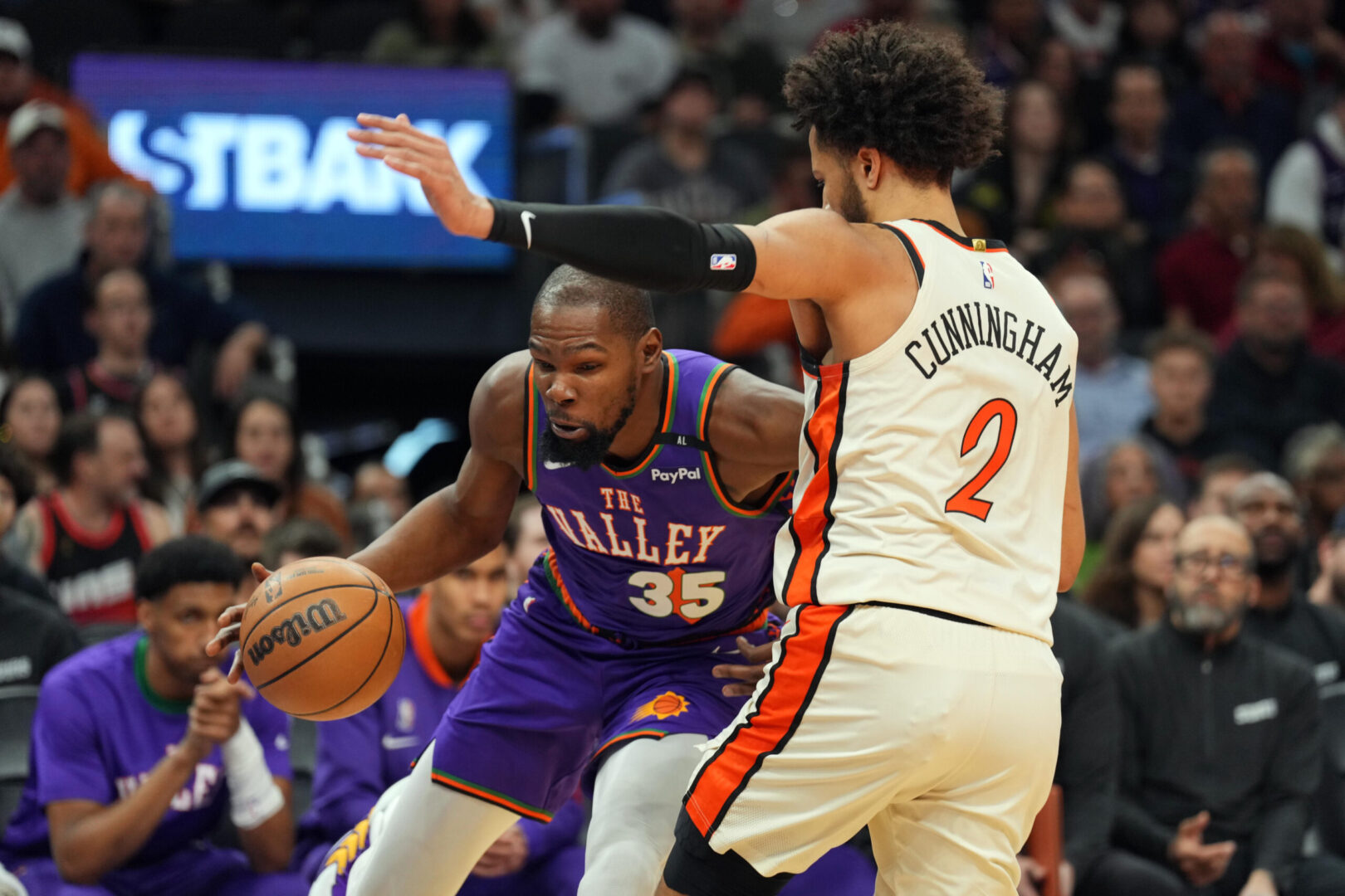 Dec 21, 2024; Phoenix, Arizona, USA; Phoenix Suns forward Kevin Durant (35) drives against Detroit Pistons guard Cade Cunningham (2) during the first half at Footprint Center. Mandatory Credit: Joe Camporeale-Imagn Images