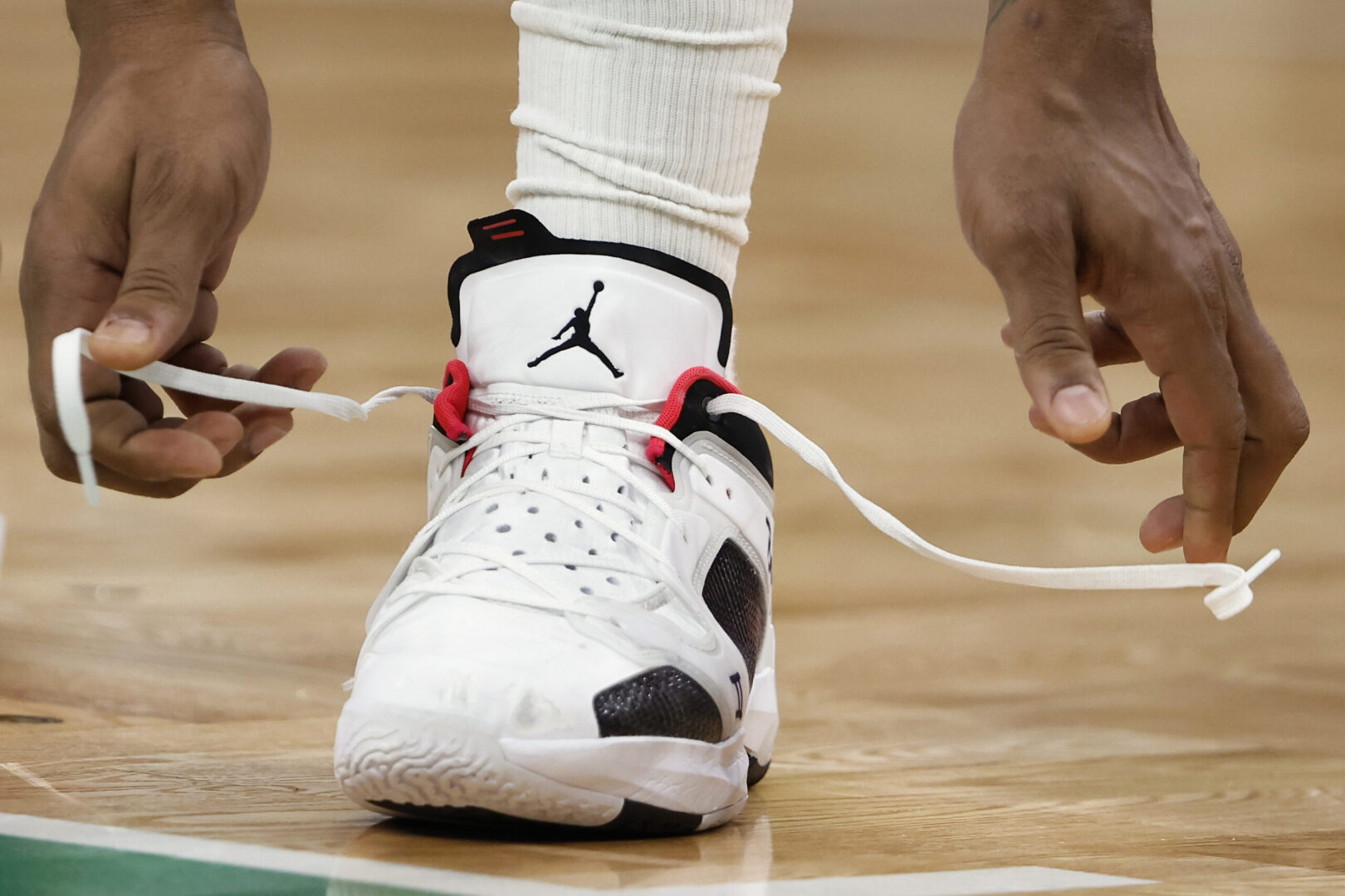 Nov 27, 2022; Boston, Massachusetts, USA; Washington Wizards guard Bradley Beal (3) ties his Nike shoe during the second half against the Boston Celtics at TD Garden. Mandatory Credit: Winslow Townson-Imagn Images