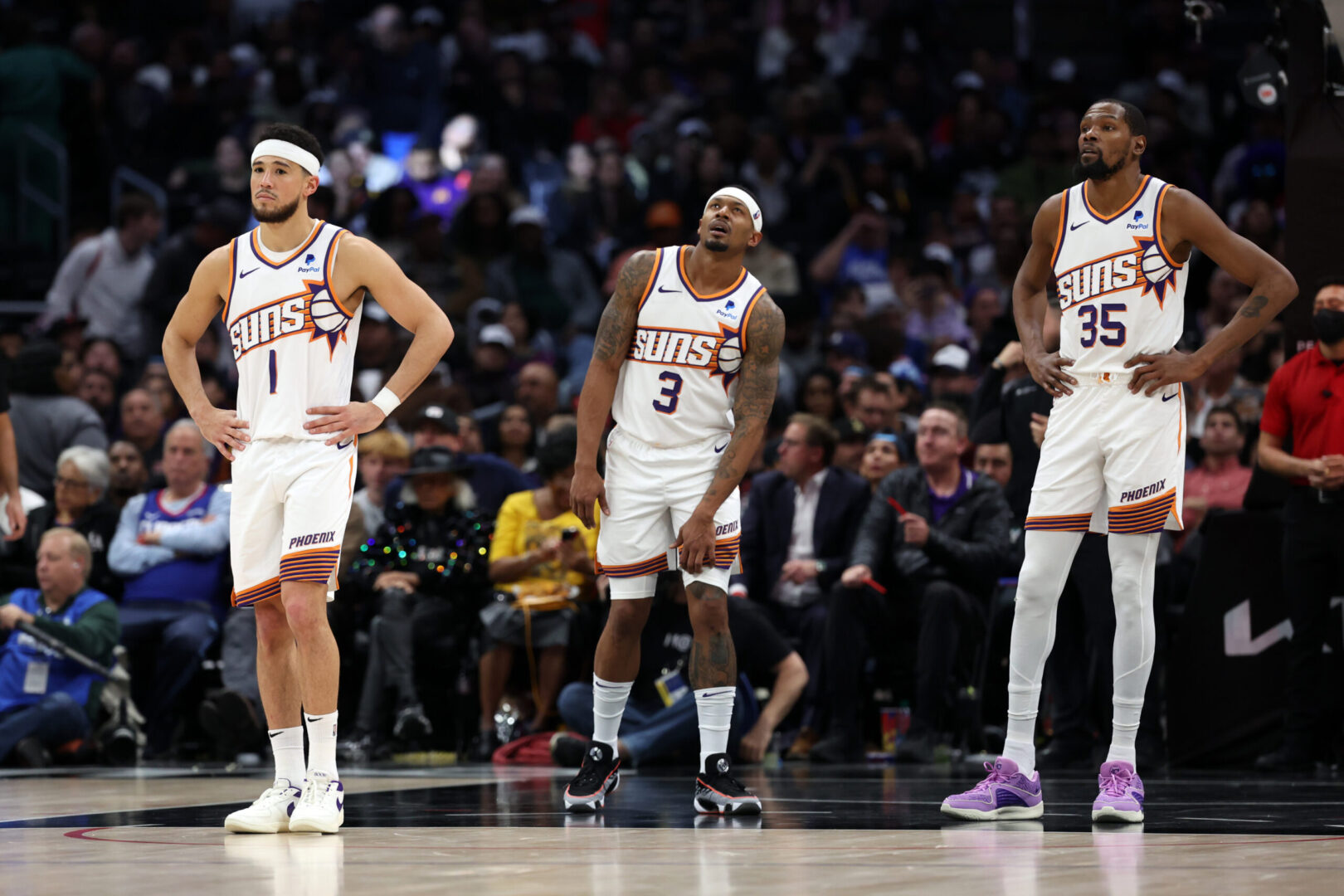 Jan 8, 2024; Los Angeles, California, USA; Phoenix Suns guard Devin Booker (1) and guard Bradley Beal (3) and forward Kevin Durant (35) stands on the floor during the fourth quarter against the Los Angeles Clippers at Crypto.com Arena. Mandatory Credit: Kiyoshi Mio-Imagn Images