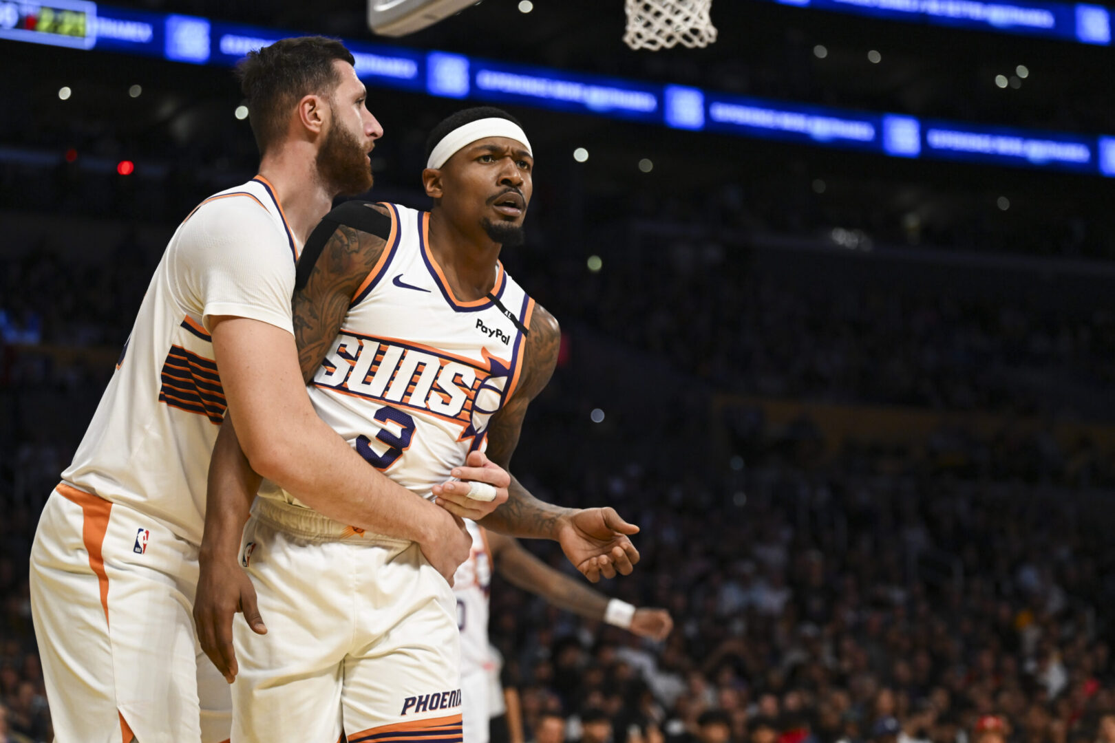 Oct 25, 2024; Los Angeles, California, USA; Phoenix Suns guard Bradley Beal (3) and center Jusuf Nurkic (20) react against the Los Angeles Lakers during the first half at Crypto.com Arena. Mandatory Credit: Jonathan Hui-Imagn Images