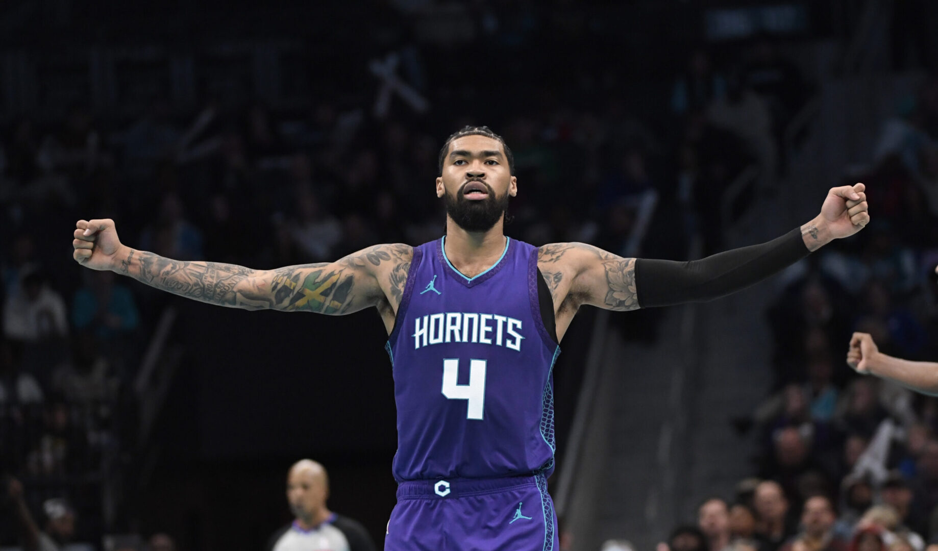 Dec 3, 2024; Charlotte, North Carolina, USA; Charlotte Hornets center Nick Richards (4) reacts to a call on the court during the second half against the Philadelphia 76ers at the Spectrum Center. Mandatory Credit: Sam Sharpe-Imagn Images