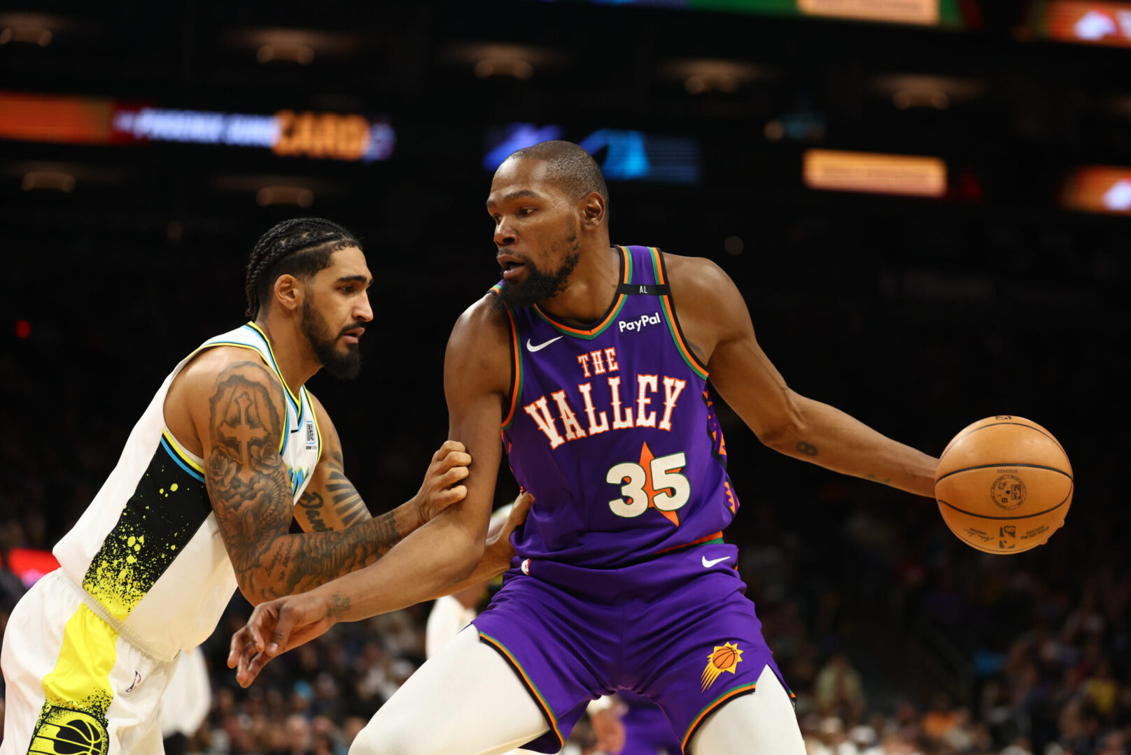 Dec 19, 2024; Phoenix, Arizona, USA; Phoenix Suns forward Kevin Durant (35) against Indiana Pacers forward Obi Toppin (1) at Footprint Center. Mandatory Credit: Mark J. Rebilas-Imagn Images