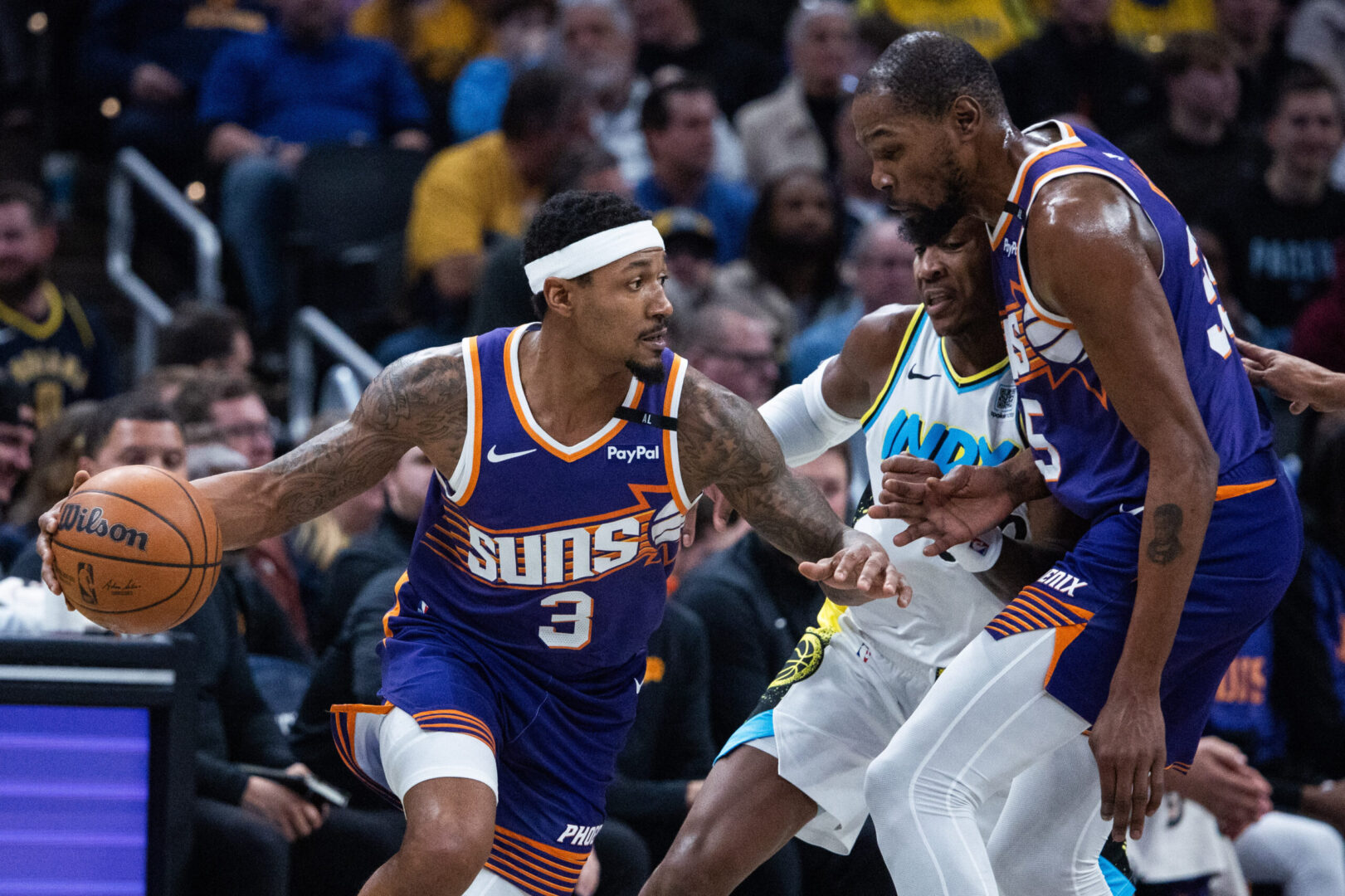 Jan 4, 2025; Indianapolis, Indiana, USA; Phoenix Suns guard Bradley Beal (3) dribbles the ball against Indiana Pacers guard Bennedict Mathurin (00) in the second half at Gainbridge Fieldhouse. Mandatory Credit: Trevor Ruszkowski-Imagn Images