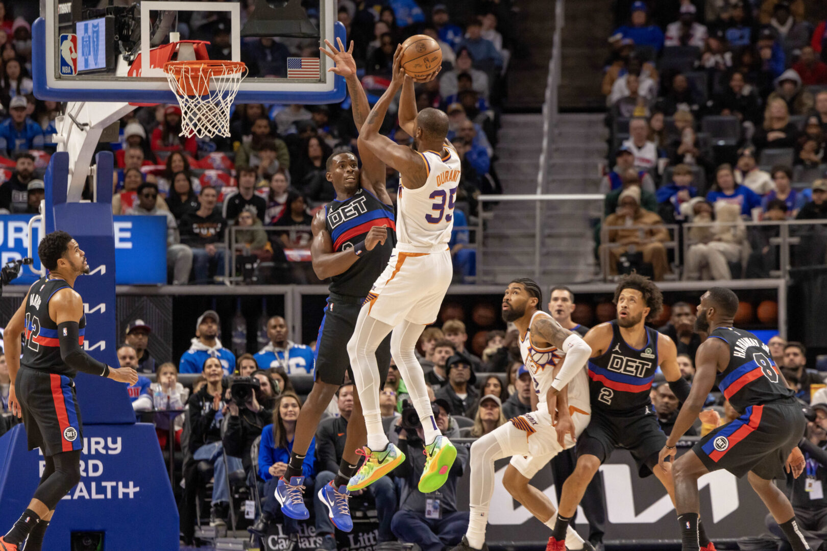 Jan 18, 2025; Detroit, Michigan, USA; Detroit Pistons center Jalen Duren (0) defends against Phoenix Suns forward Kevin Durant (35) during the first quarter at Little Caesars Arena. Mandatory Credit: David Reginek-Imagn Images